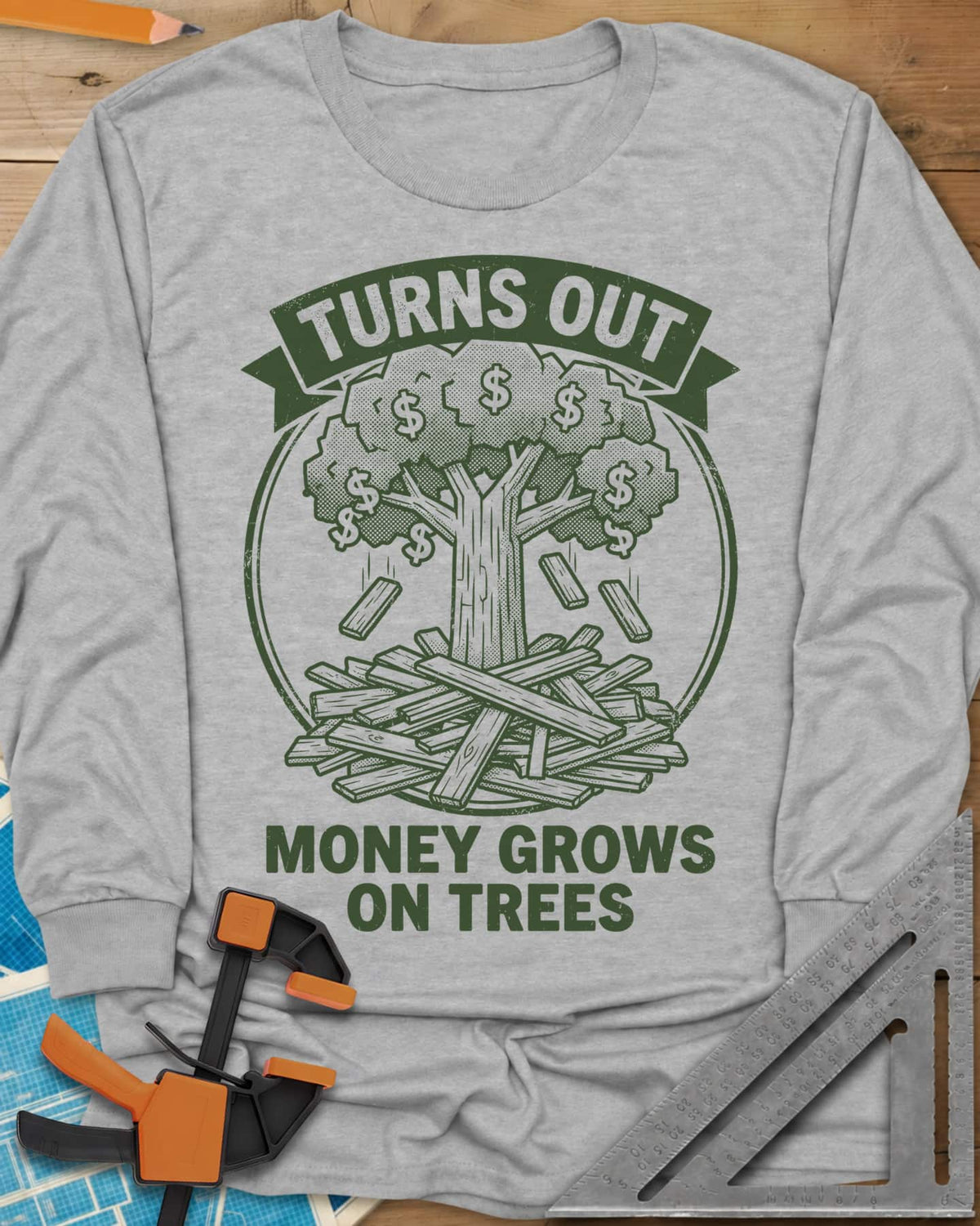 Money Grows On Trees long sleeve shirt in Sport Grey, a round emblem of a tree with dollar-sign leaves above a lumber pile
