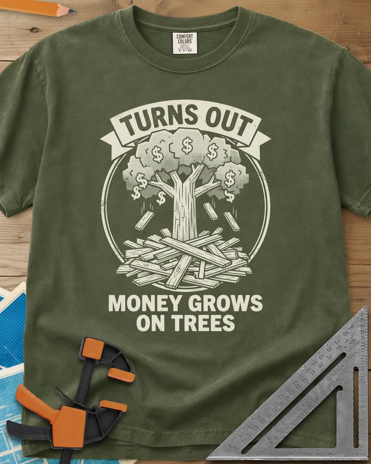 Money Grows On Trees heavyweight tee in Hemp, a round emblem of a tree with dollar-sign leaves above a lumber pile