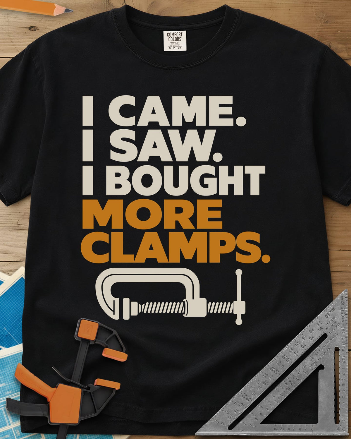 More Clamps heavyweight tee in Black, four lines of block letters with a C-clamp underneath