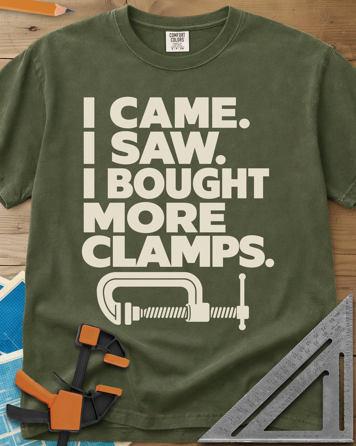 More Clamps heavyweight tee in Hemp, four lines of block letters with a C-clamp underneath