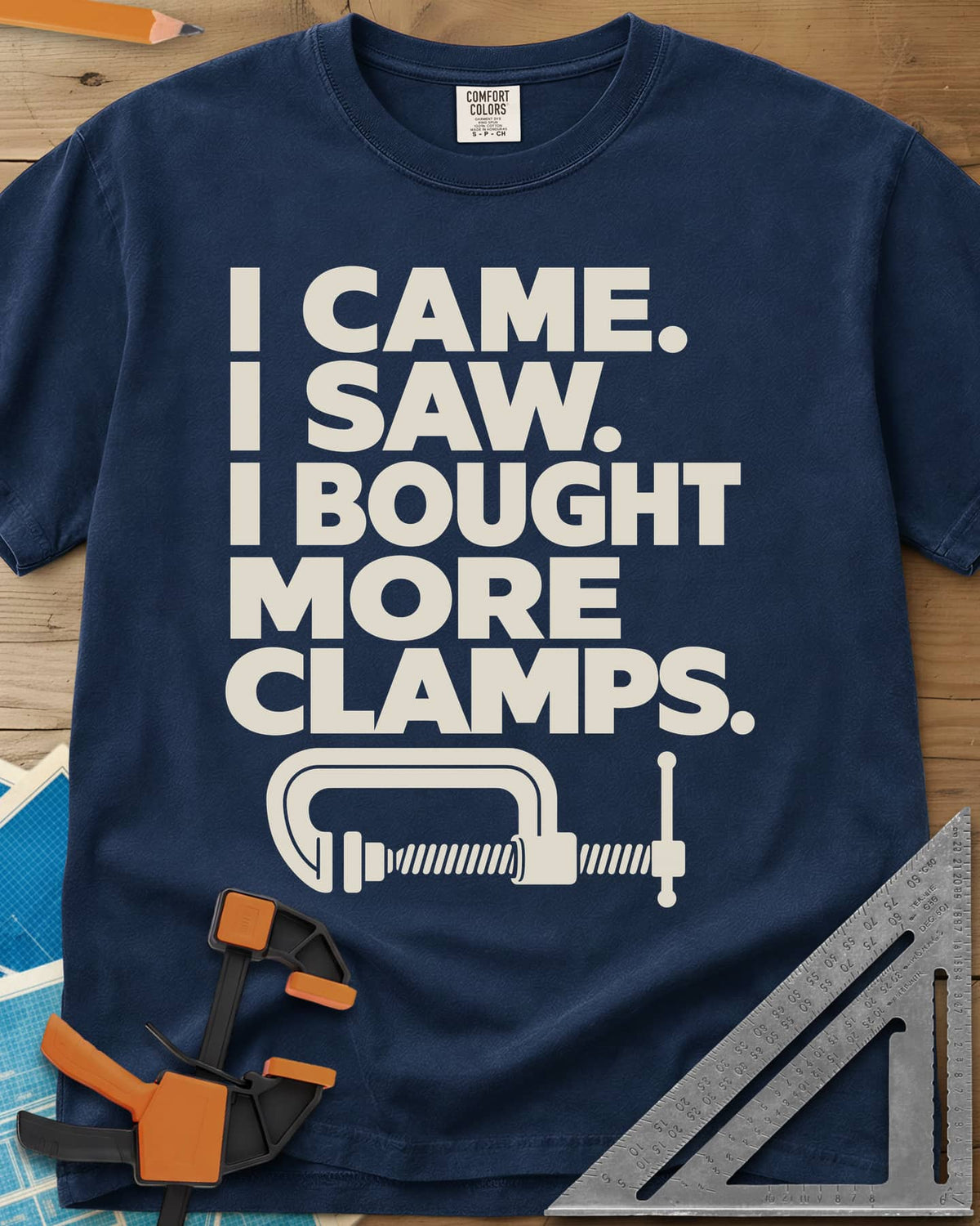 More Clamps heavyweight tee in Navy, four lines of block letters with a C-clamp underneath