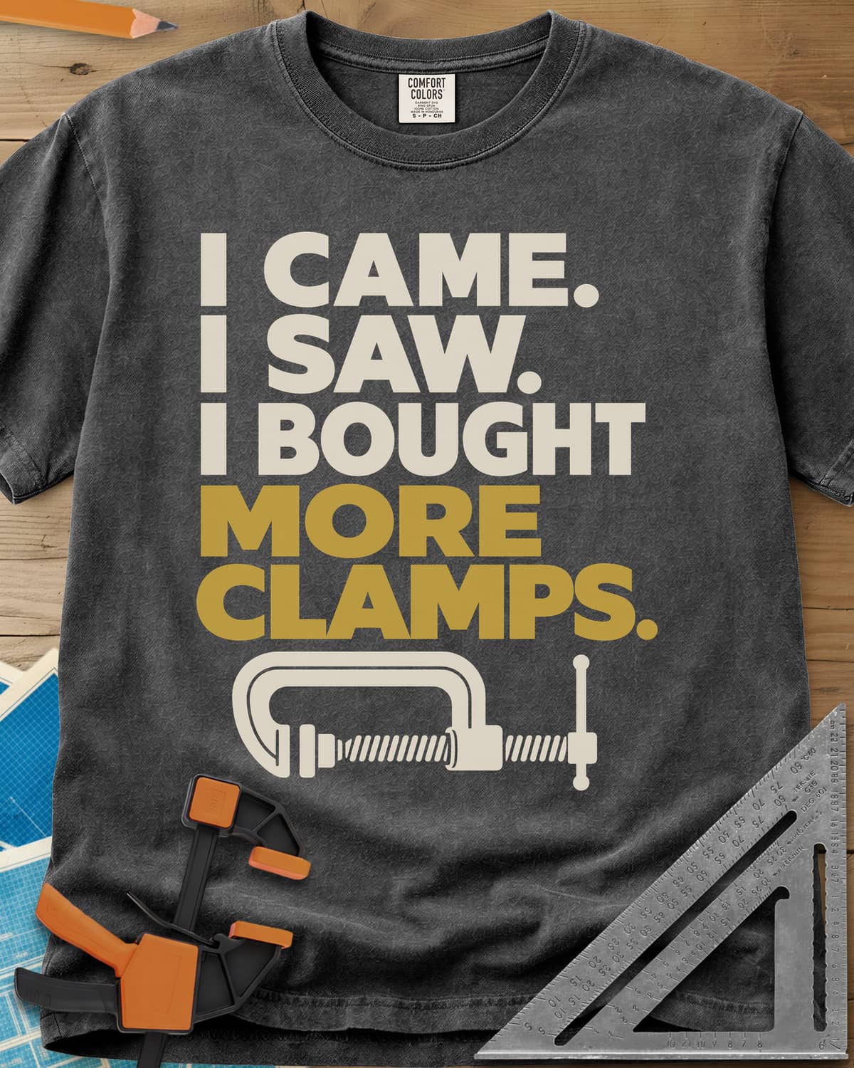 More Clamps heavyweight tee in Pepper, four lines of block letters with a C-clamp underneath