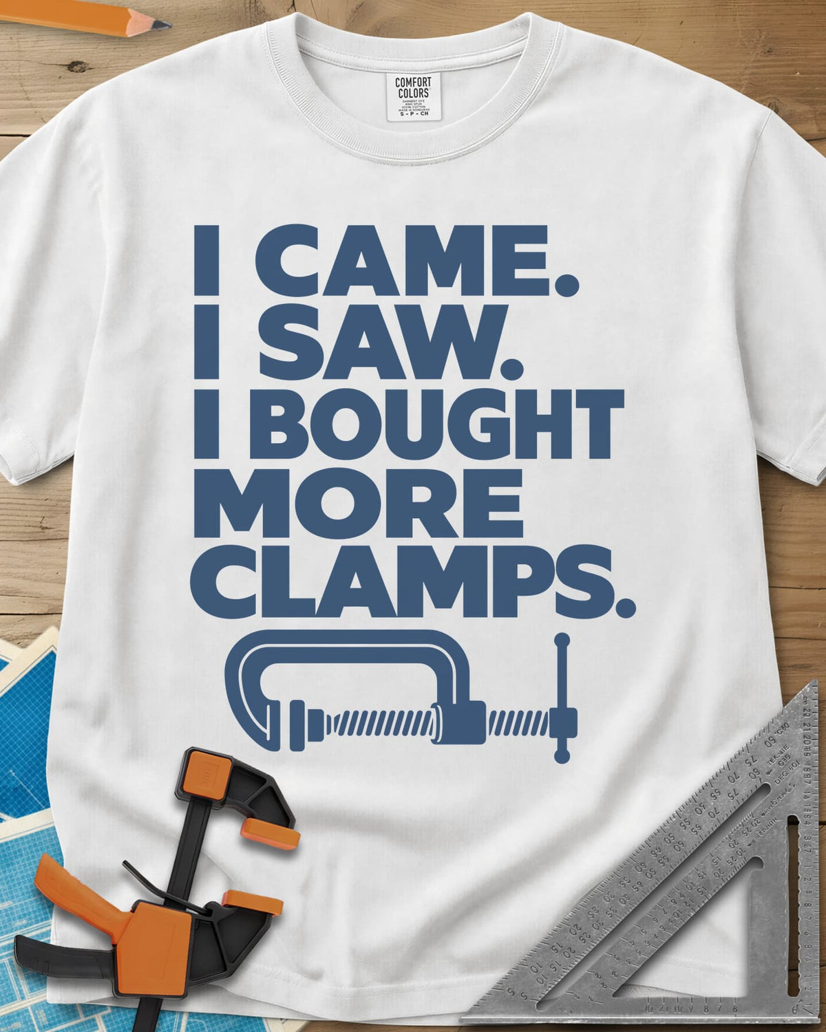 More Clamps heavyweight tee in White, four lines of block letters with a C-clamp underneath
