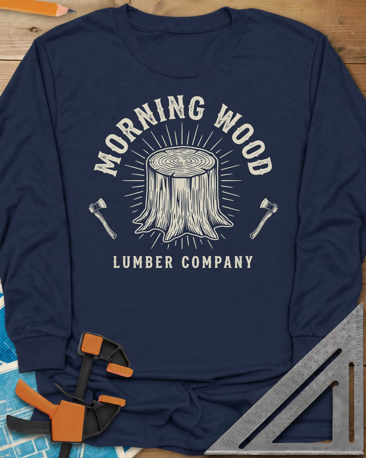Morning Wood Lumber Company long sleeve shirt in Navy, a tree stump with sunburst rays between two axes