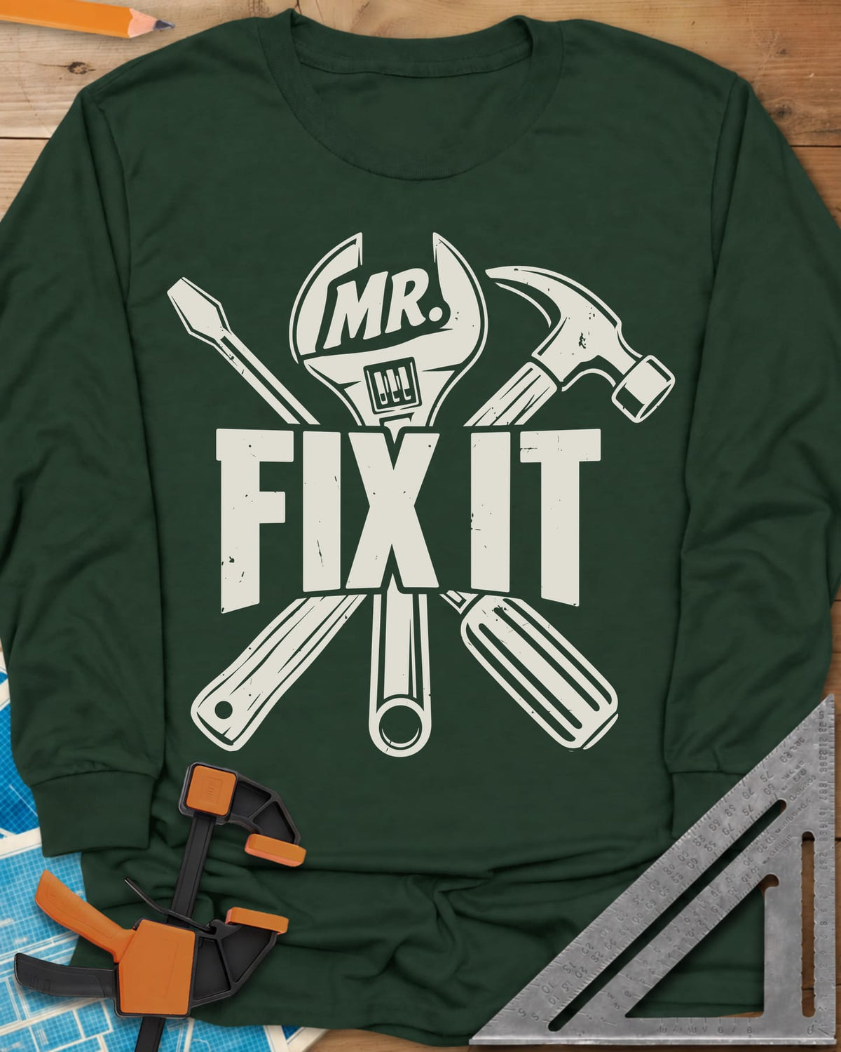 Mr. Fix It long sleeve shirt in Forest Green, crossed wrench, hammer and screwdriver behind block letters