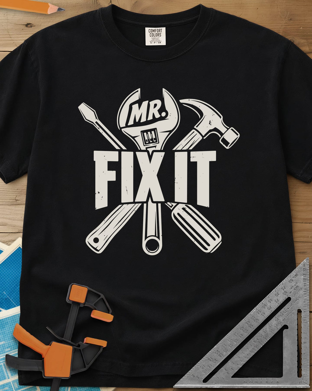 Mr. Fix It heavyweight tee in Black, crossed wrench, hammer and screwdriver behind block letters