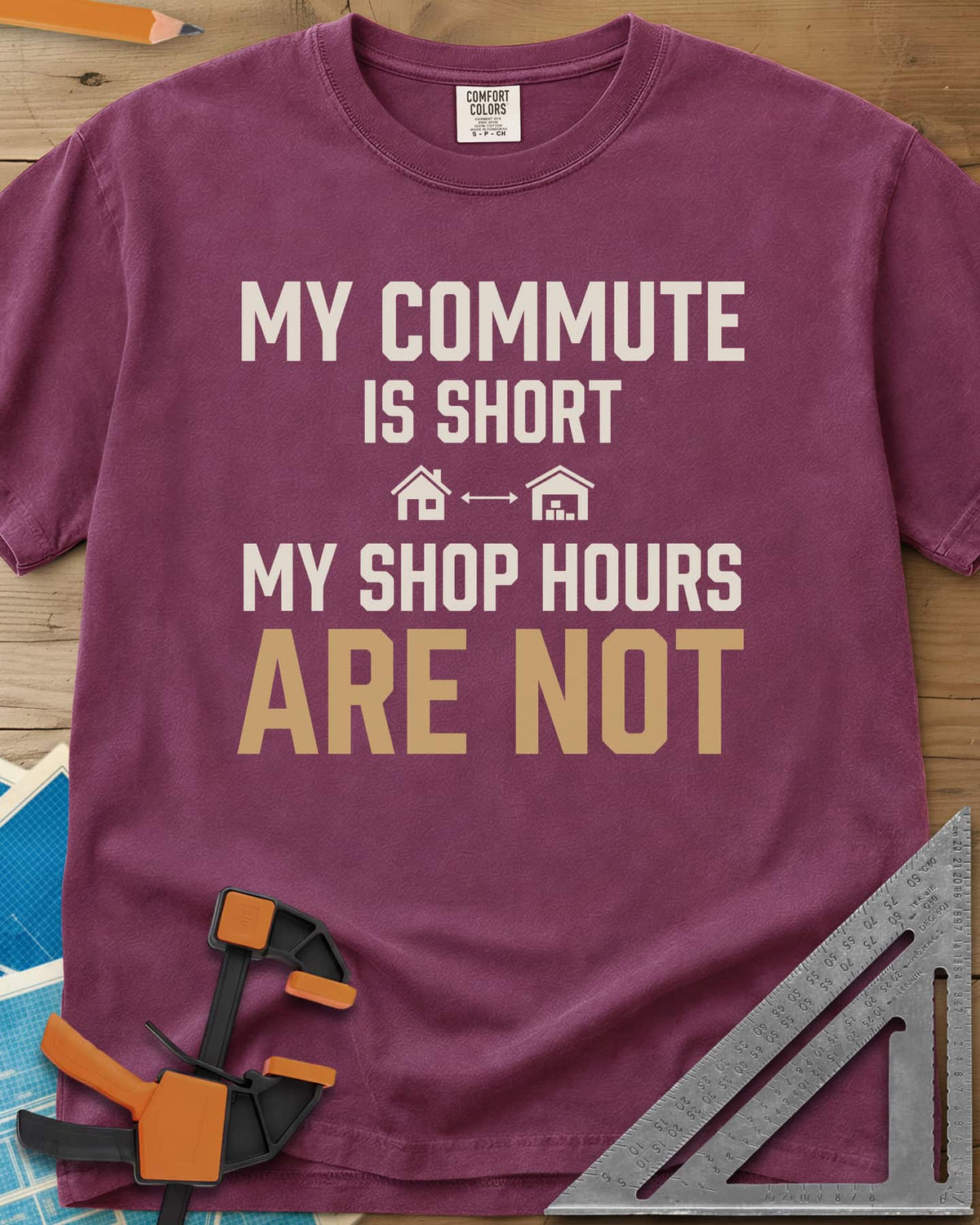 My Commute Is Short heavyweight tee in Berry, bold lettering with a house and garage joined by a double arrow