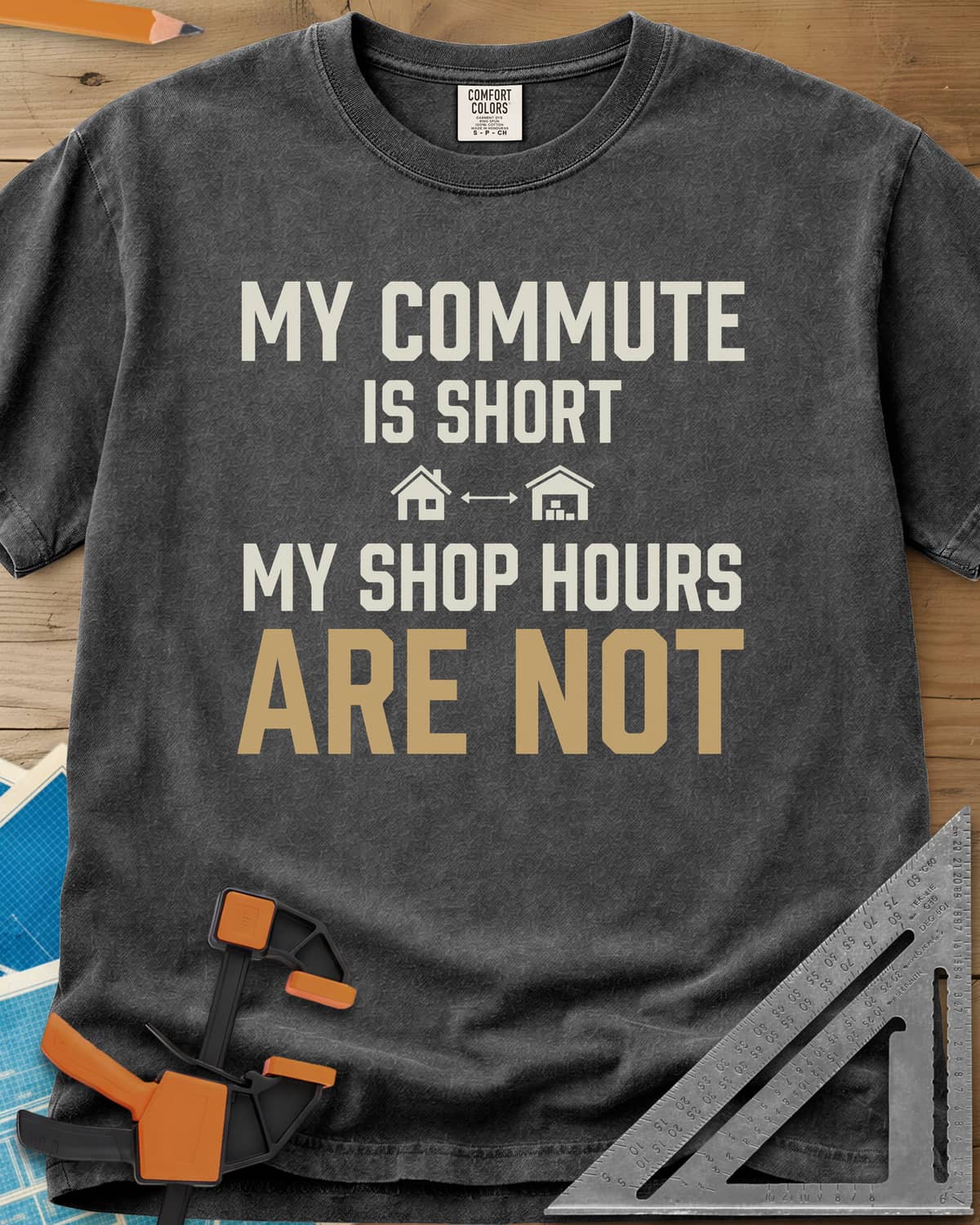 My Commute Is Short heavyweight tee in Pepper, bold lettering with a house and garage joined by a double arrow