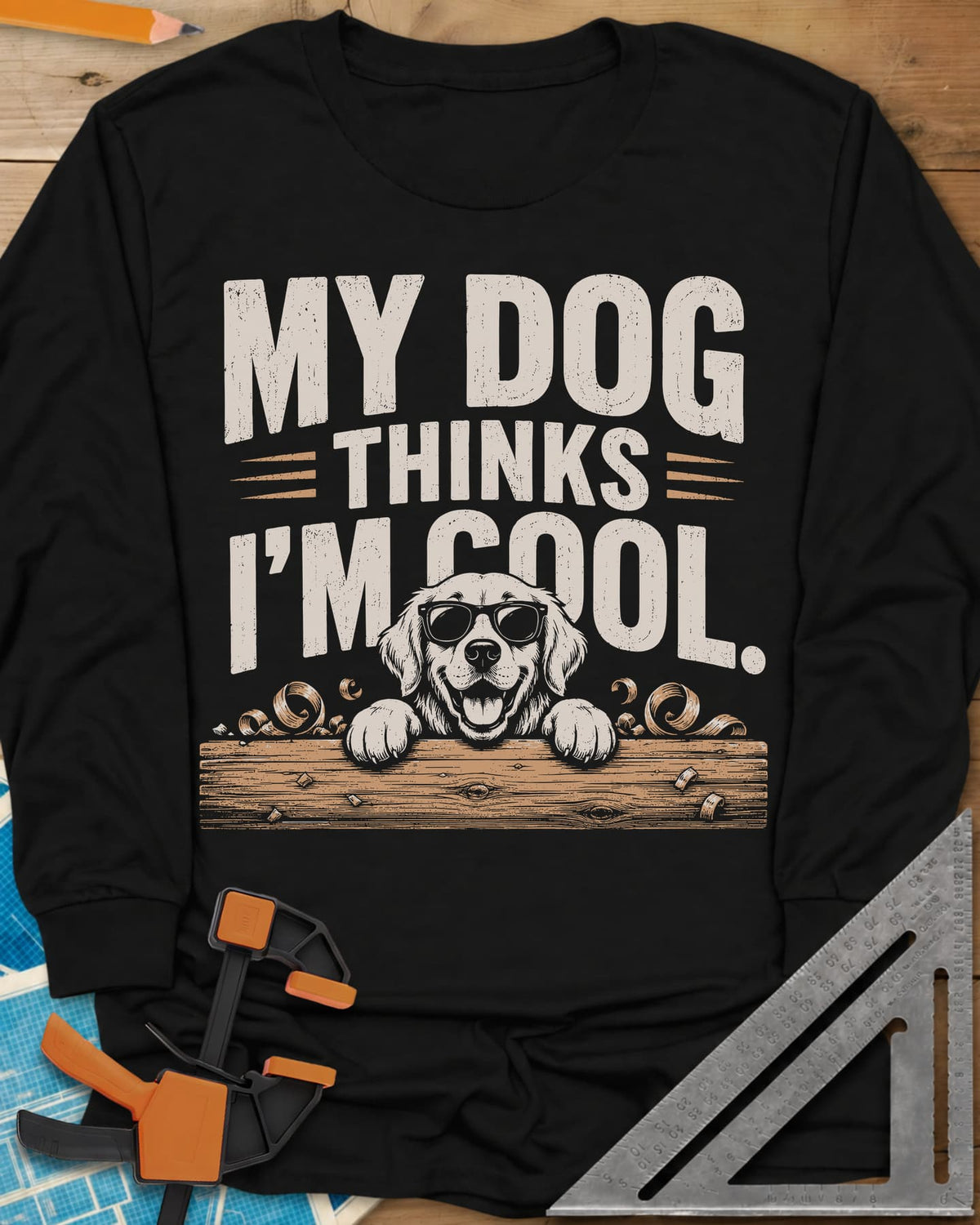 My Dog Thinks I’m Cool long sleeve shirt in Black, a golden retriever in sunglasses peeking over a wood plank