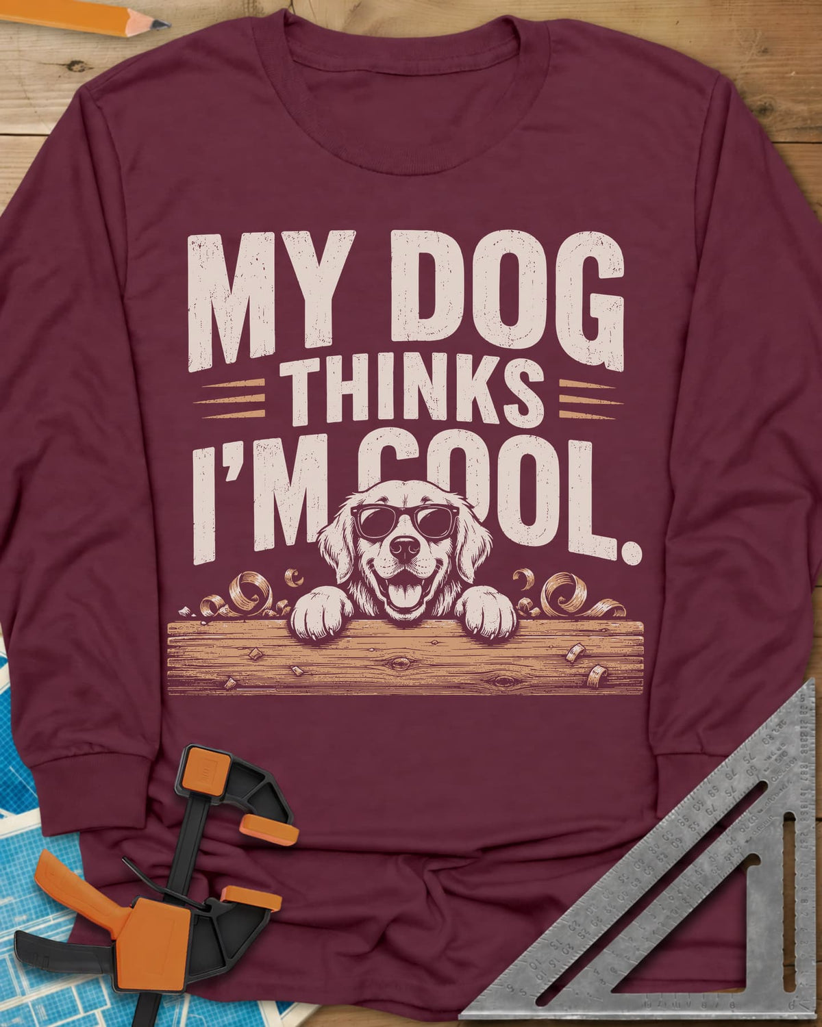 My Dog Thinks I’m Cool long sleeve shirt in Maroon, a golden retriever in sunglasses peeking over a wood plank