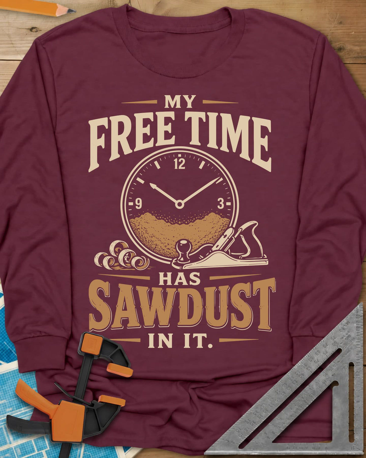My Free Time Has Sawdust In It long sleeve shirt in Maroon, a clock face half full of sawdust beside a hand plane and