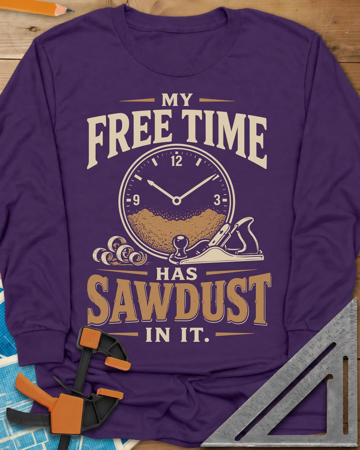 My Free Time Has Sawdust In It long sleeve shirt in Purple, a clock face half full of sawdust beside a hand plane and