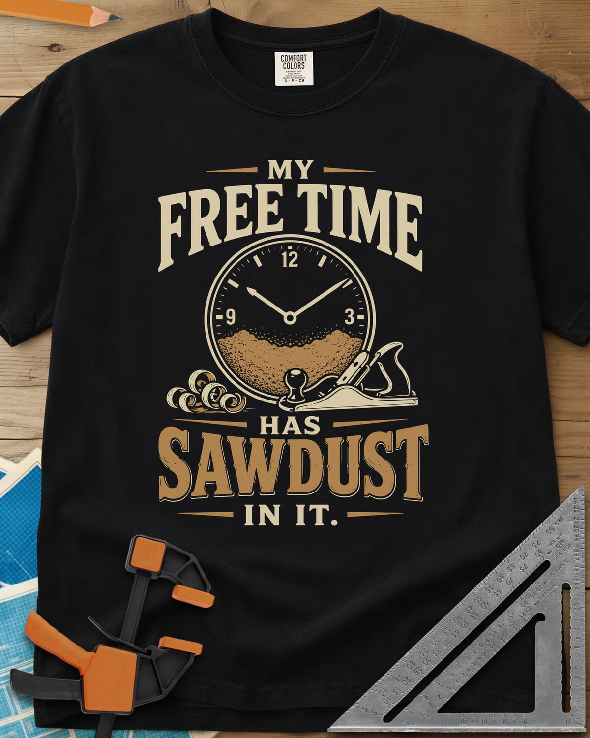 My Free Time Has Sawdust In It heavyweight tee in Black, a clock face half full of sawdust beside a hand plane and shavings