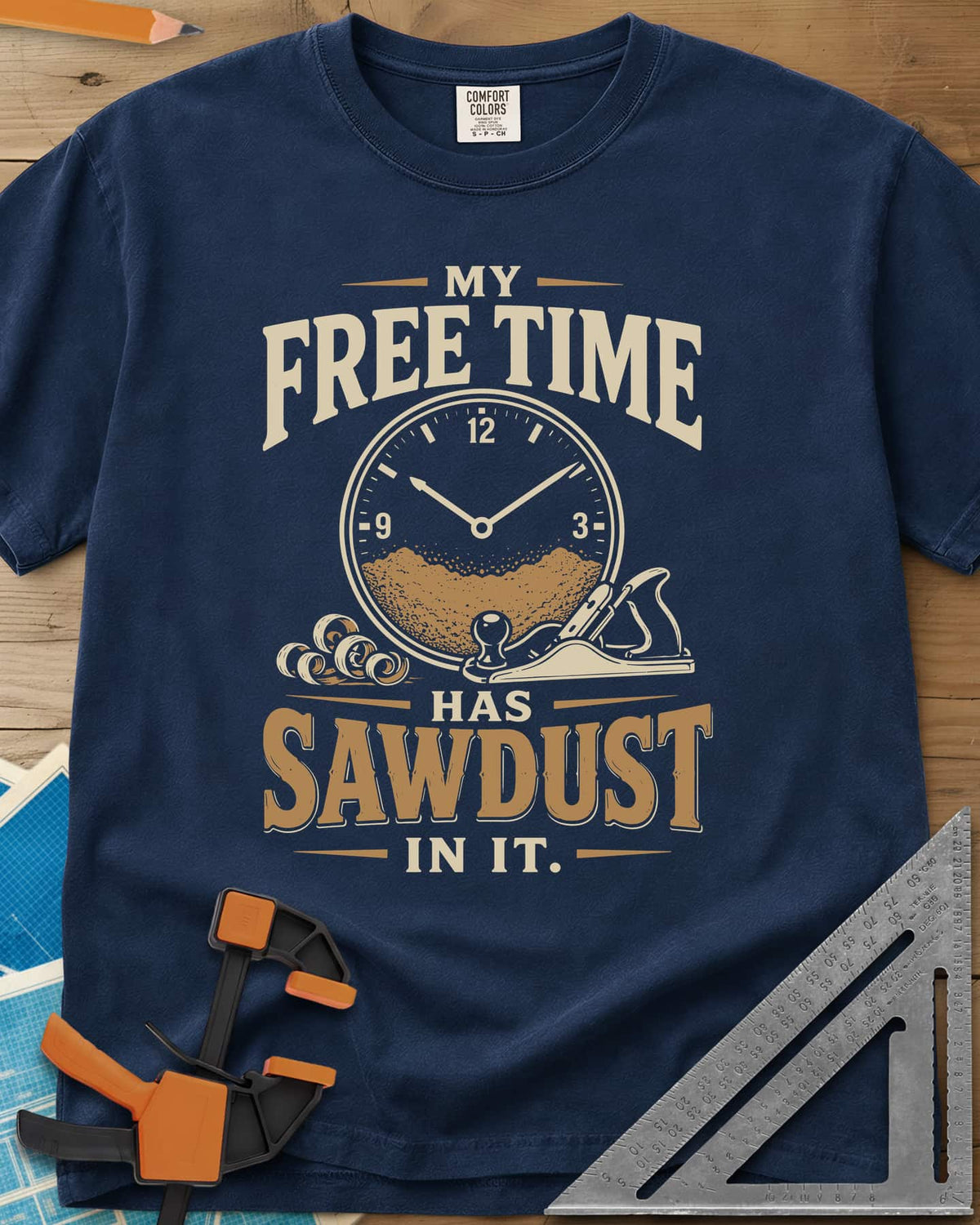 My Free Time Has Sawdust In It heavyweight tee in Navy, a clock face half full of sawdust beside a hand plane and shavings