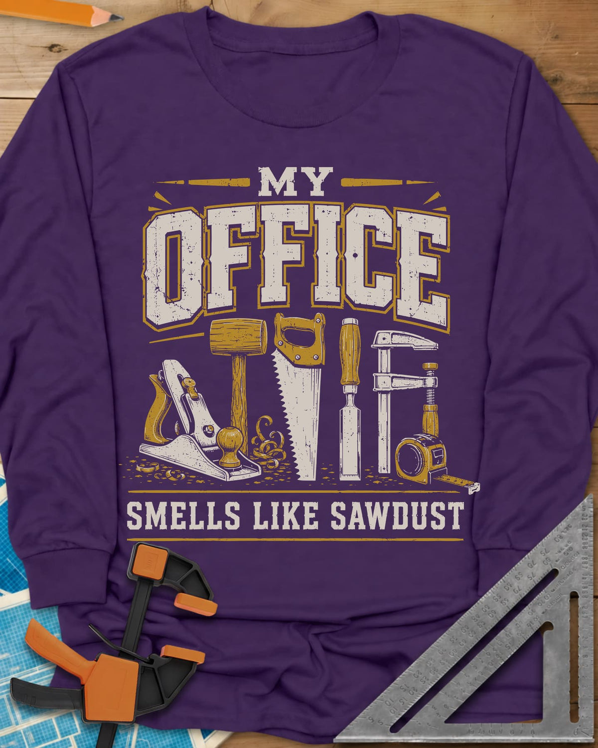 My Office Smells Like Sawdust long sleeve shirt in Purple, a row of hand tools: plane, mallet, saw, chisel, clamp, tape