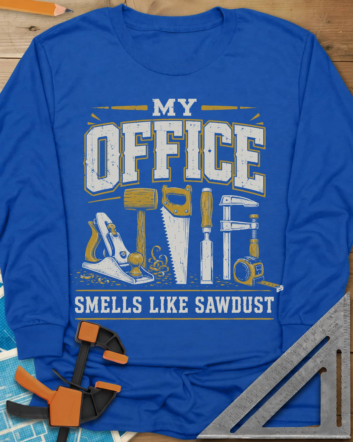 My Office Smells Like Sawdust long sleeve shirt in Royal, a row of hand tools: plane, mallet, saw, chisel, clamp, tape