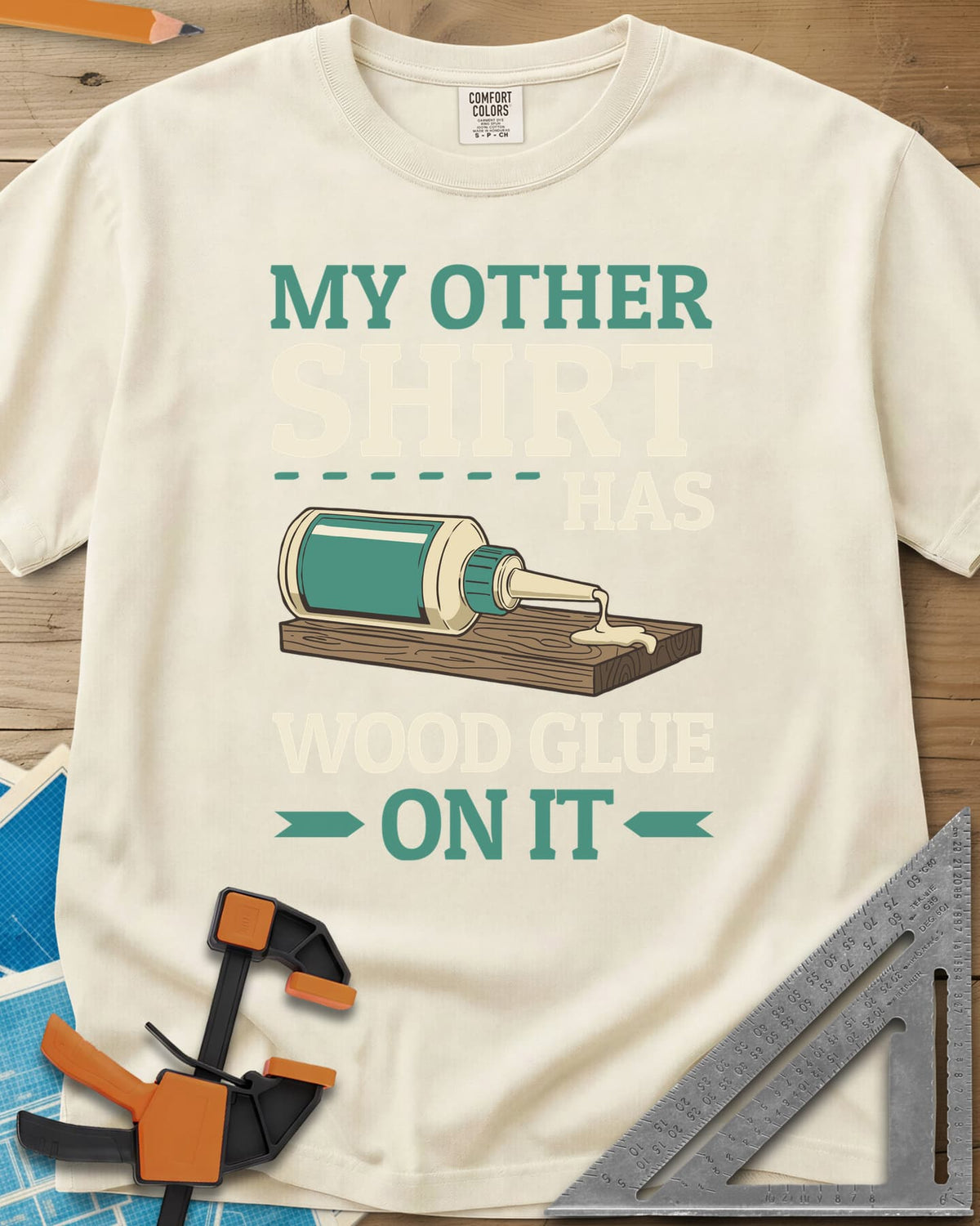 My Other Shirt Has Wood Glue On It heavyweight tee in Ivory, a tipped-over wood glue bottle dripping onto a board