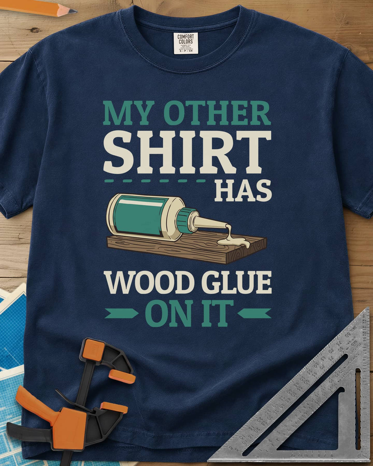 My Other Shirt Has Wood Glue On It heavyweight tee in Navy, a tipped-over wood glue bottle dripping onto a board