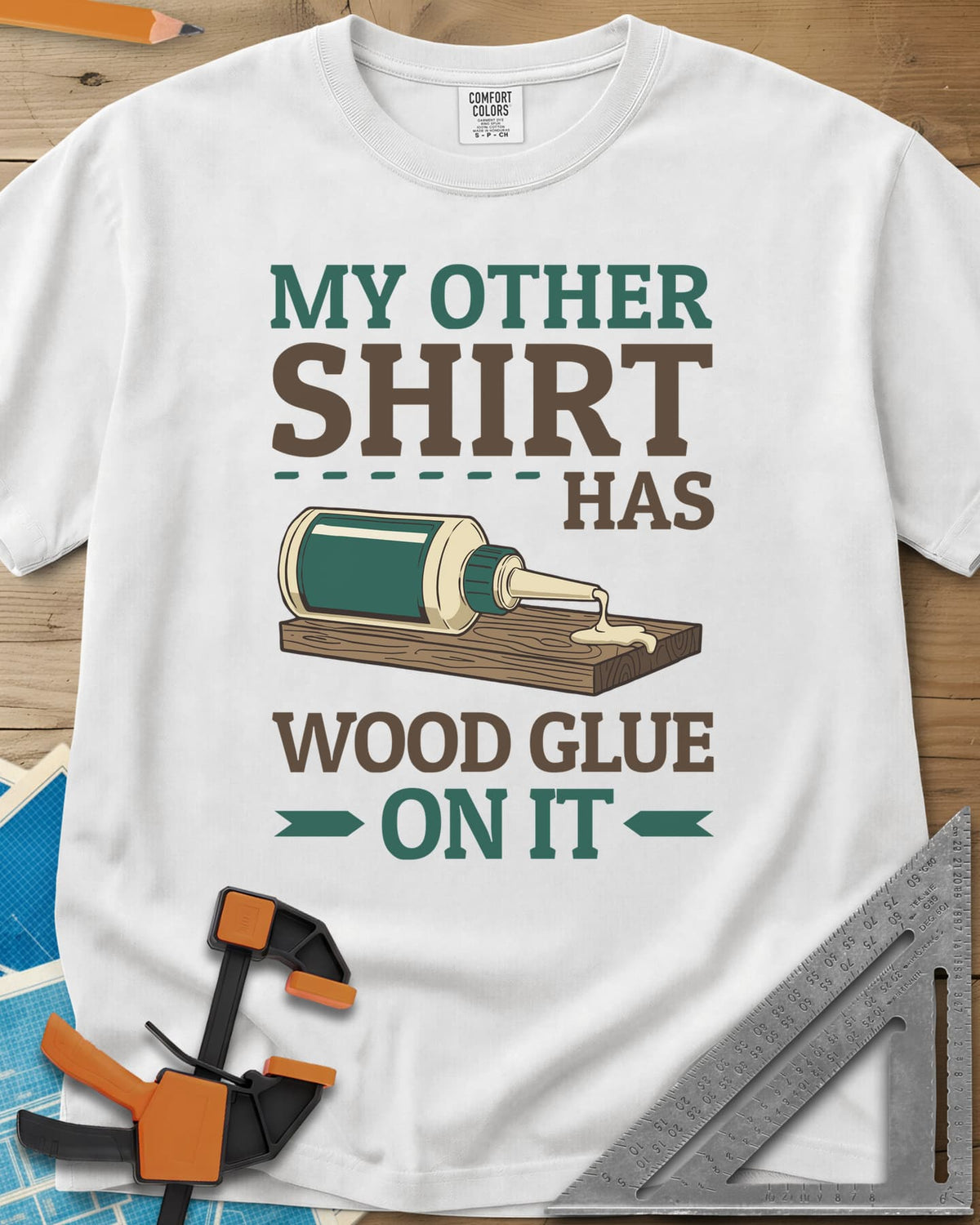 My Other Shirt Has Wood Glue On It heavyweight tee in White, a tipped-over wood glue bottle dripping onto a board