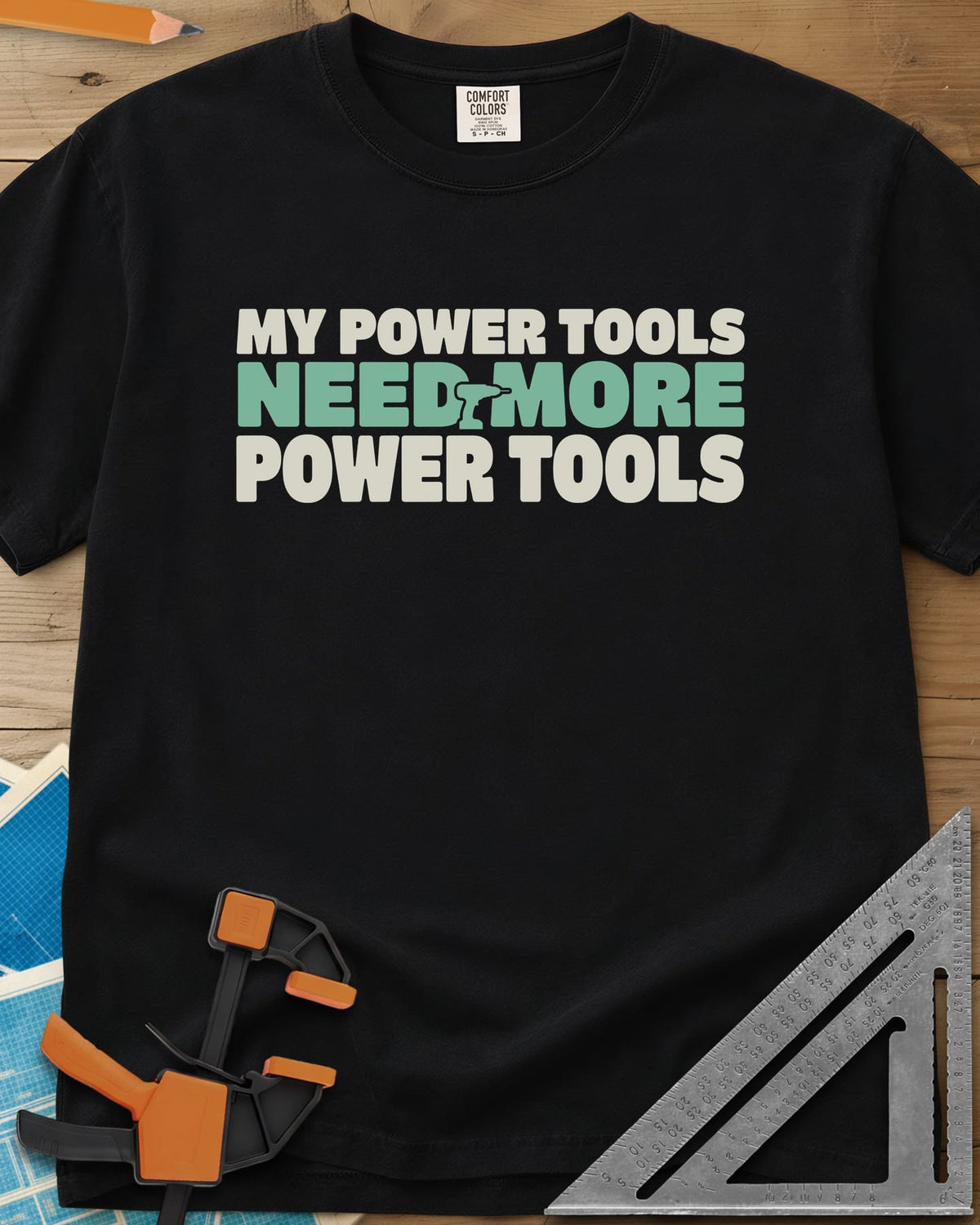 My Power Tools Need More Power Tools heavyweight tee in Black, bold three-line type with a tiny cordless drill in the middle