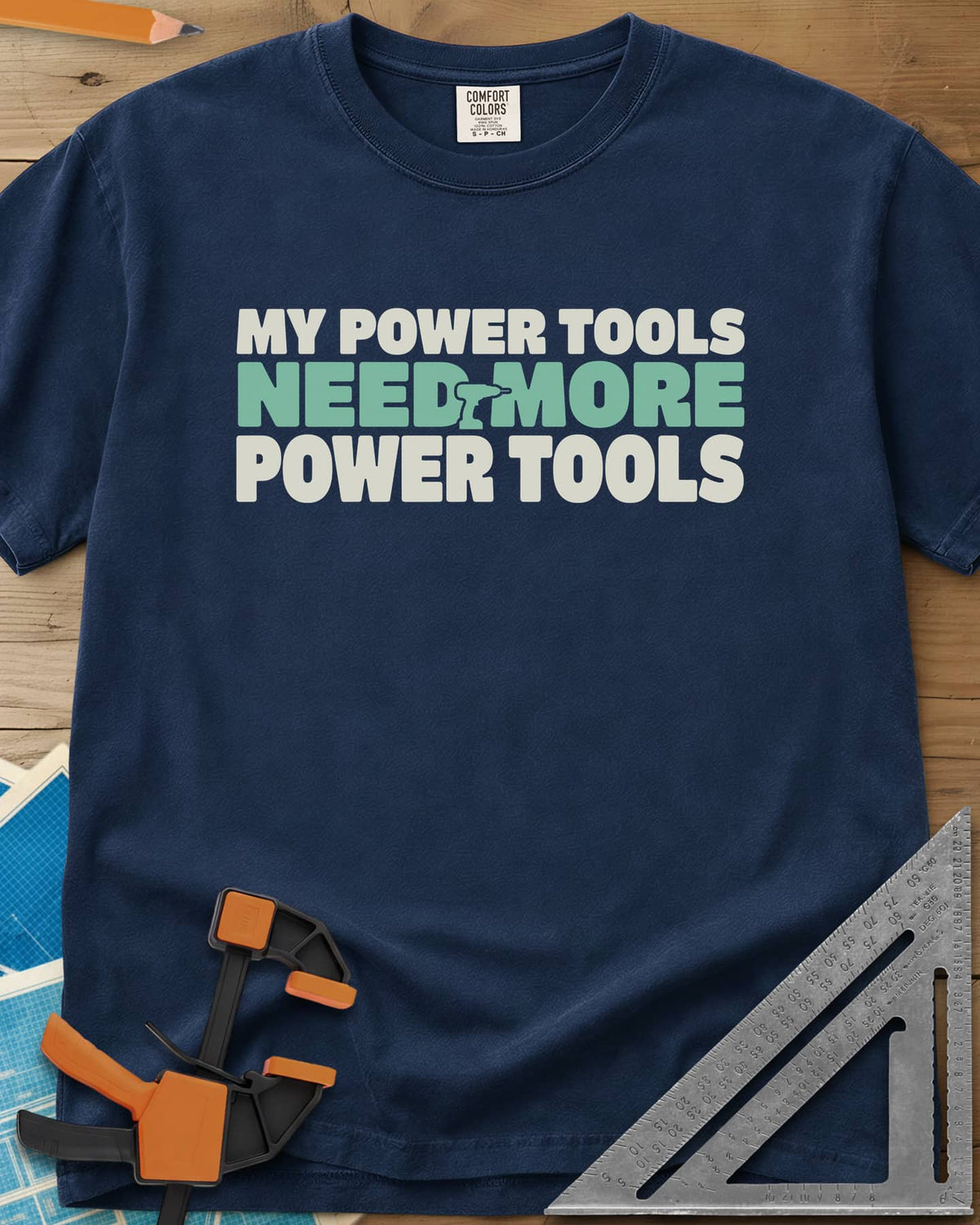 My Power Tools Need More Power Tools heavyweight tee in Navy, bold three-line type with a tiny cordless drill in the middle