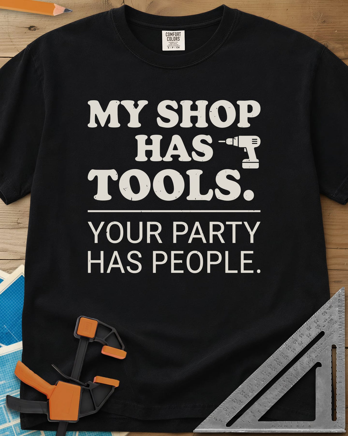 My Shop Has Tools Your Party Has People heavyweight tee in Black, two-part slogan split by a line, with a small cordless