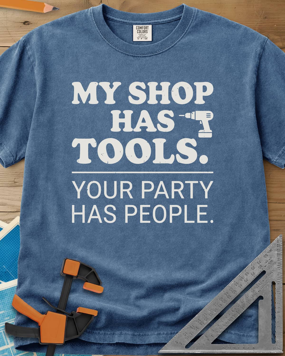 My Shop Has Tools Your Party Has People heavyweight tee in Blue Jean, two-part slogan split by a line, with a small cordless