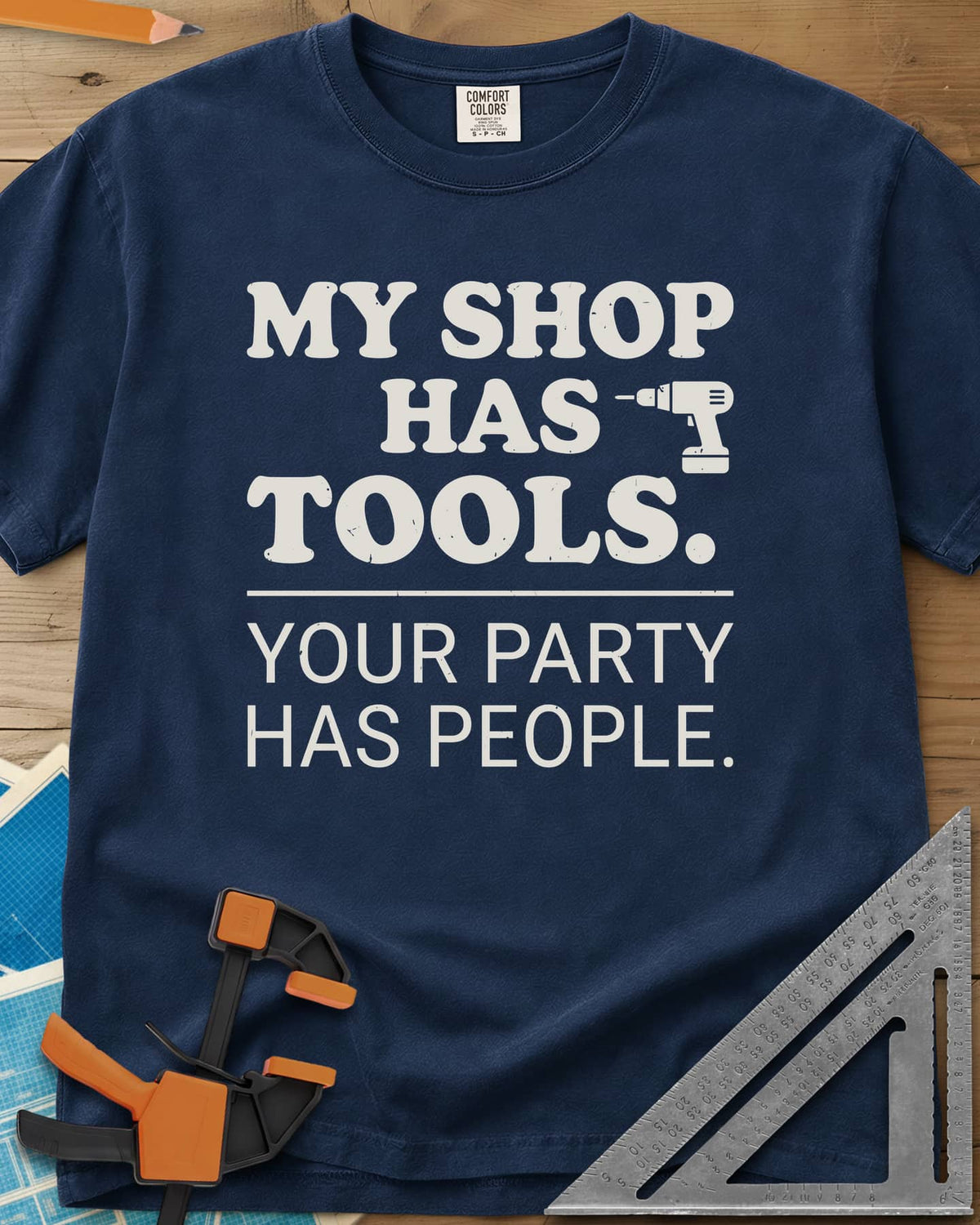 My Shop Has Tools Your Party Has People heavyweight tee in Navy, two-part slogan split by a line, with a small cordless