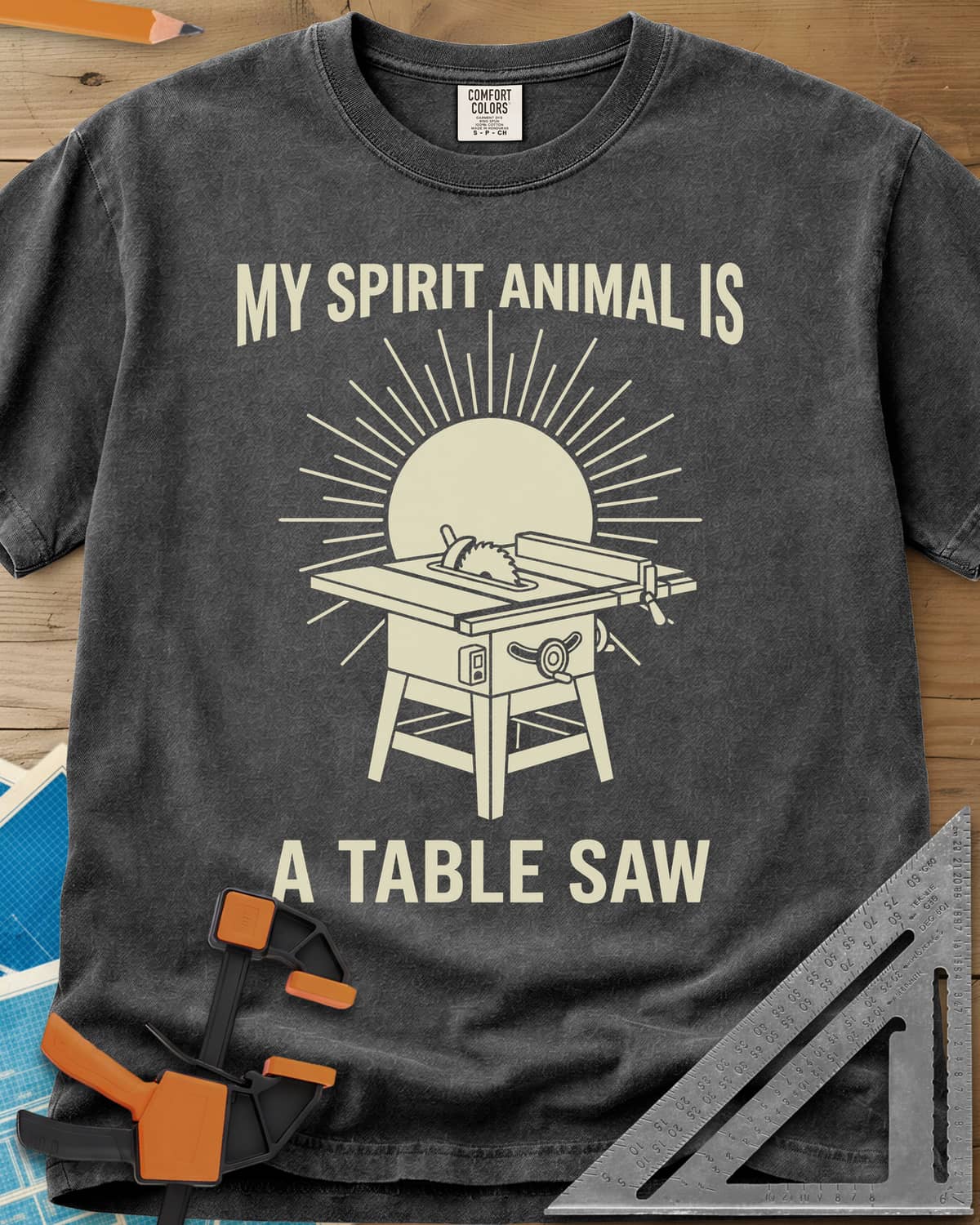 My Spirit Animal Is A Table Saw heavyweight tee in Pepper, a table saw drawn in front of a sunburst