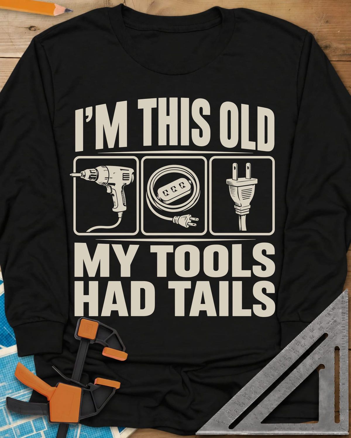 My Tools Had Tails long sleeve shirt in Black, three framed panels: a corded drill, an extension cord, a plug