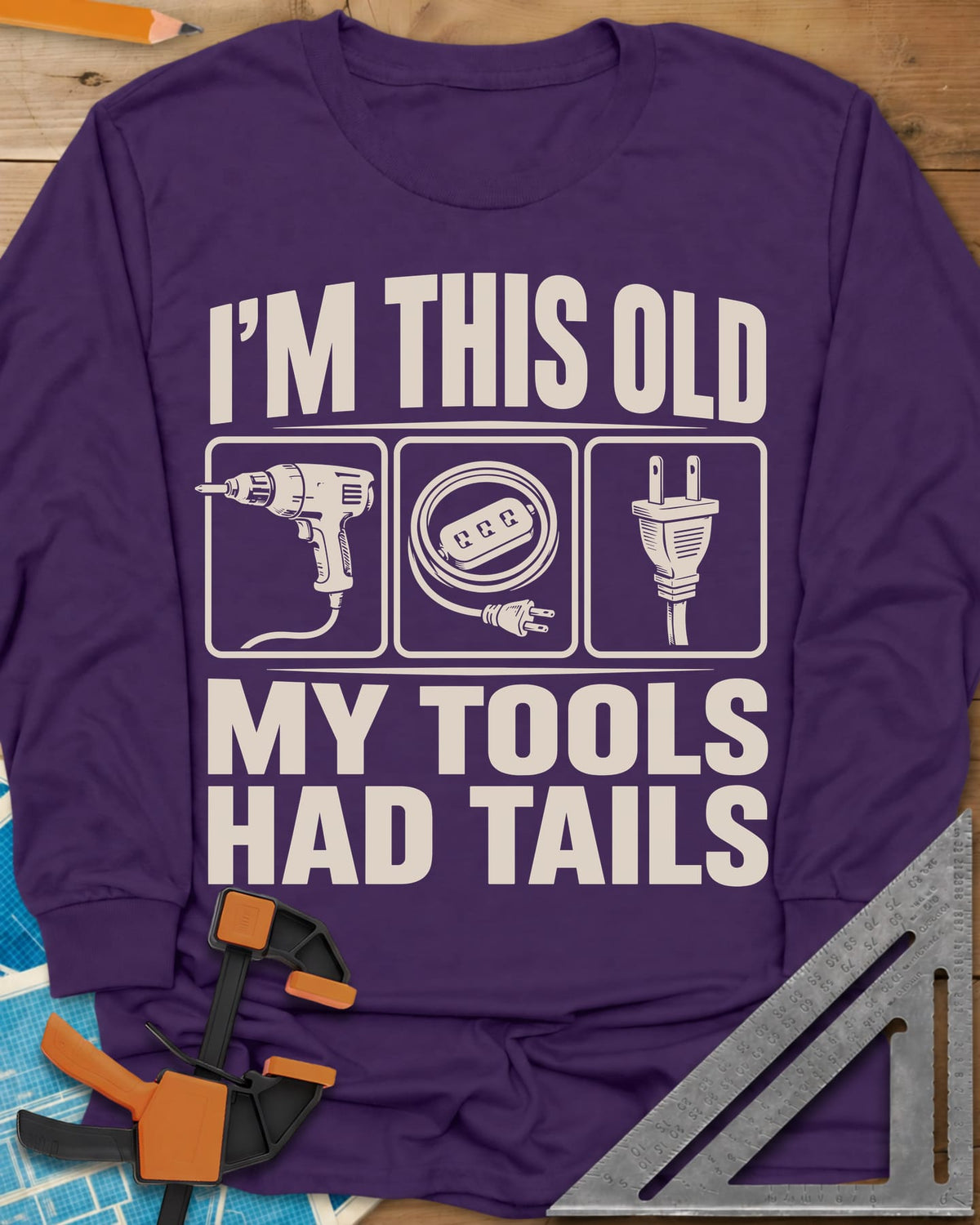 My Tools Had Tails long sleeve shirt in Purple, three framed panels: a corded drill, an extension cord, a plug
