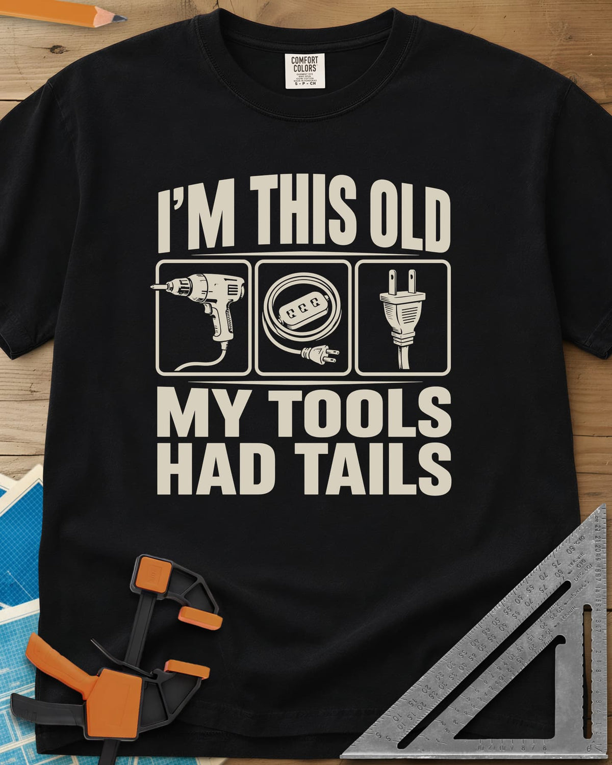 My Tools Had Tails heavyweight tee in Black, three framed panels: a corded drill, an extension cord, a plug