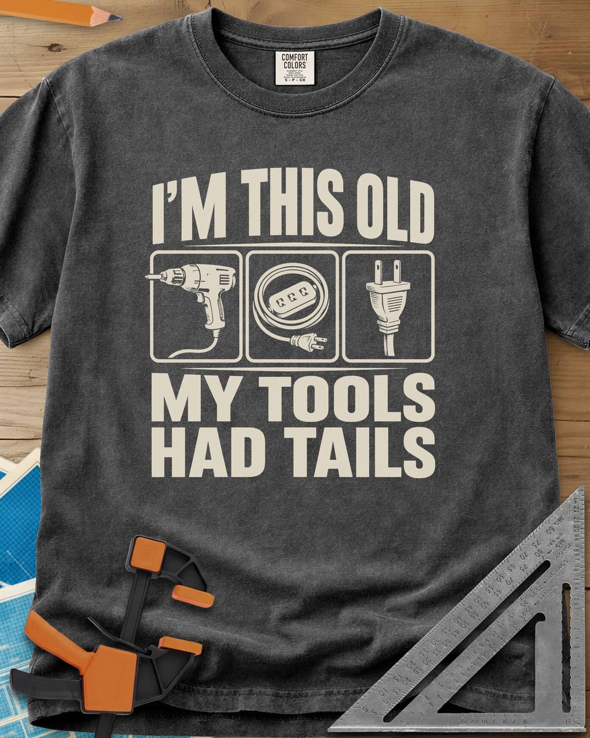 My Tools Had Tails heavyweight tee in Pepper, three framed panels: a corded drill, an extension cord, a plug