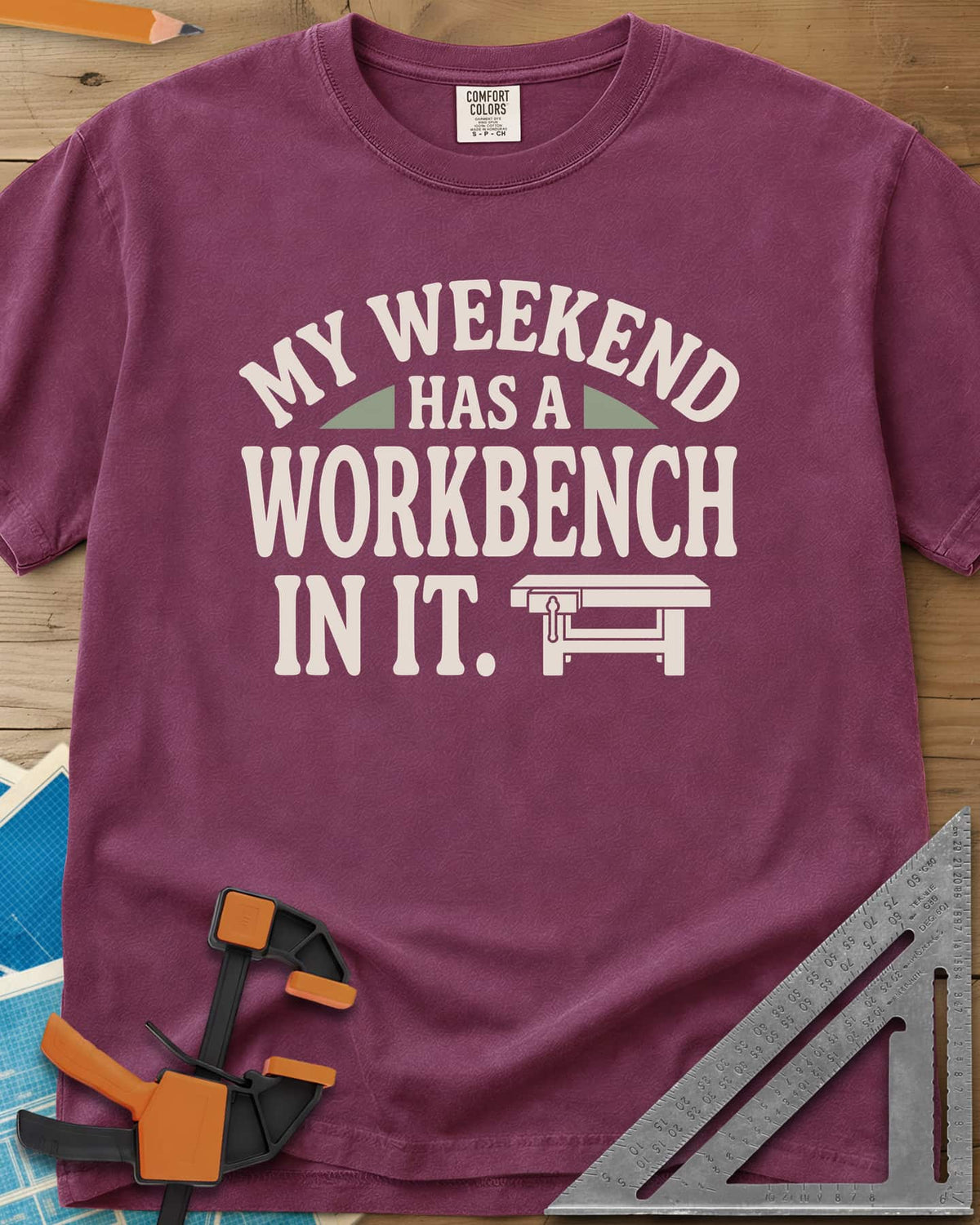 My Weekend Has A Workbench heavyweight tee in Berry, arched lettering with a small icon of a workbench with a vise