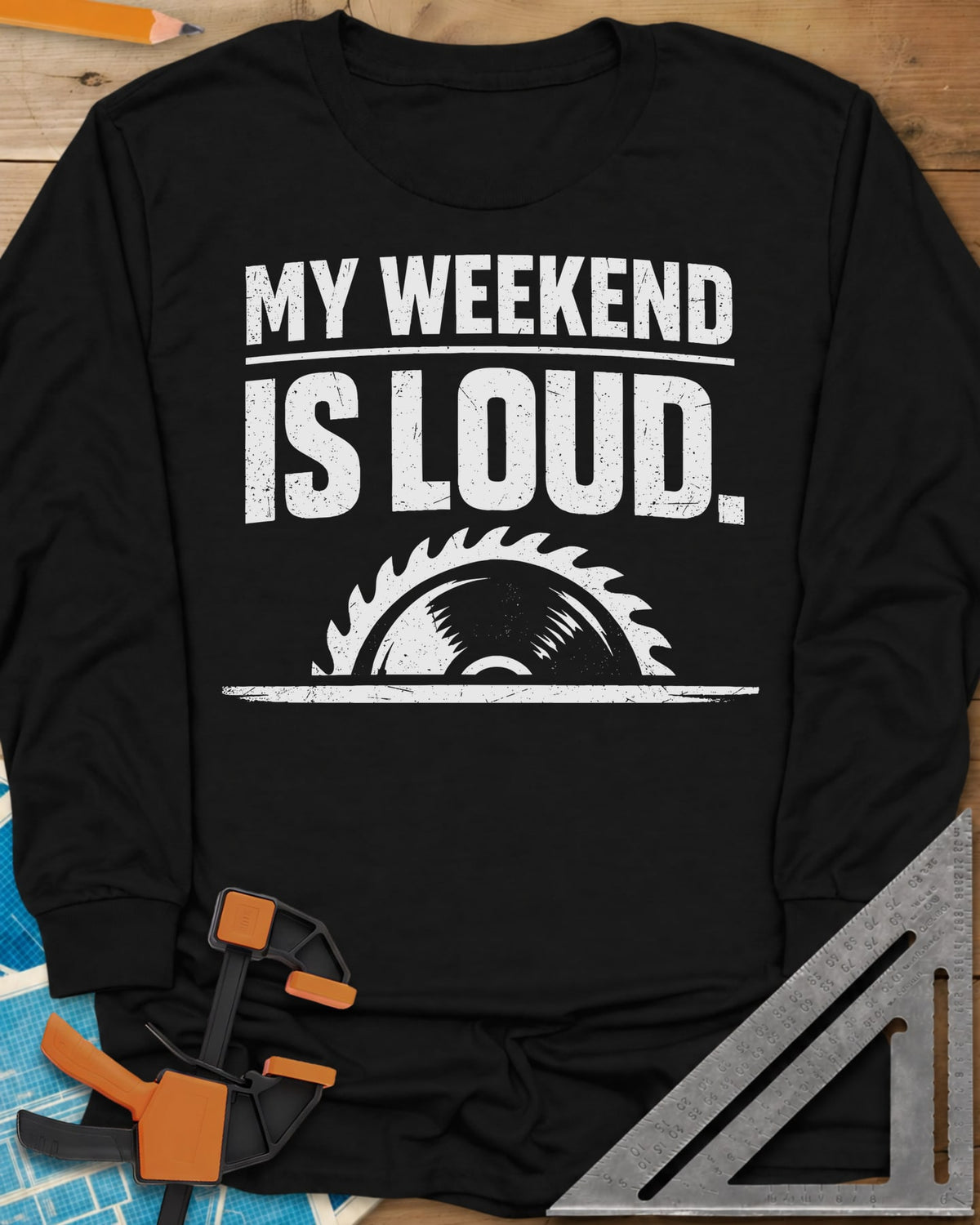My Weekend Is Loud long sleeve shirt in Black, distressed block lettering over half a saw blade rising from a line