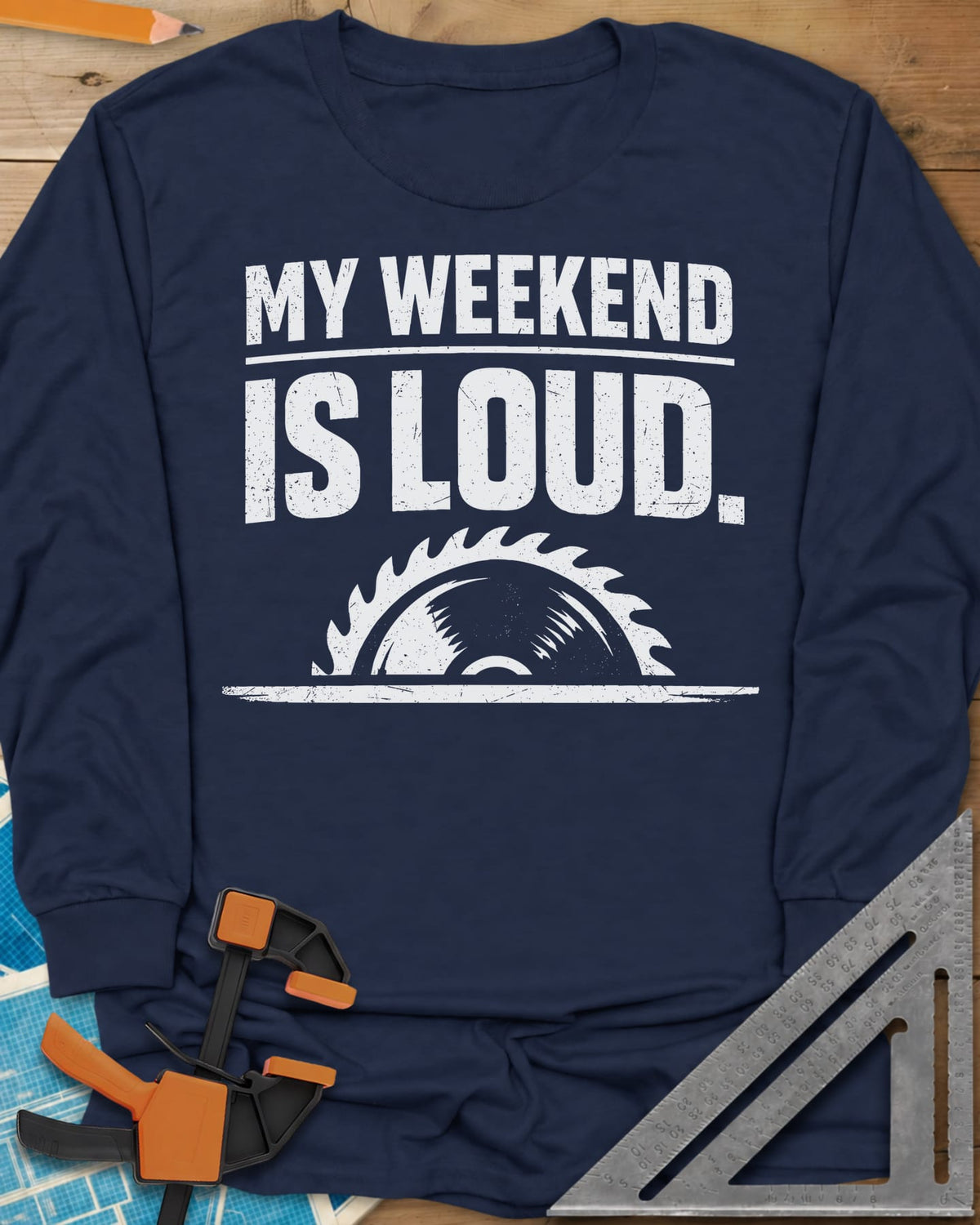 My Weekend Is Loud long sleeve shirt in Navy, distressed block lettering over half a saw blade rising from a line