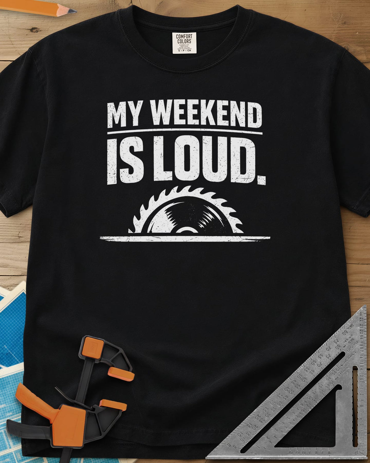 My Weekend Is Loud heavyweight tee in Black, distressed block lettering over half a saw blade rising from a line