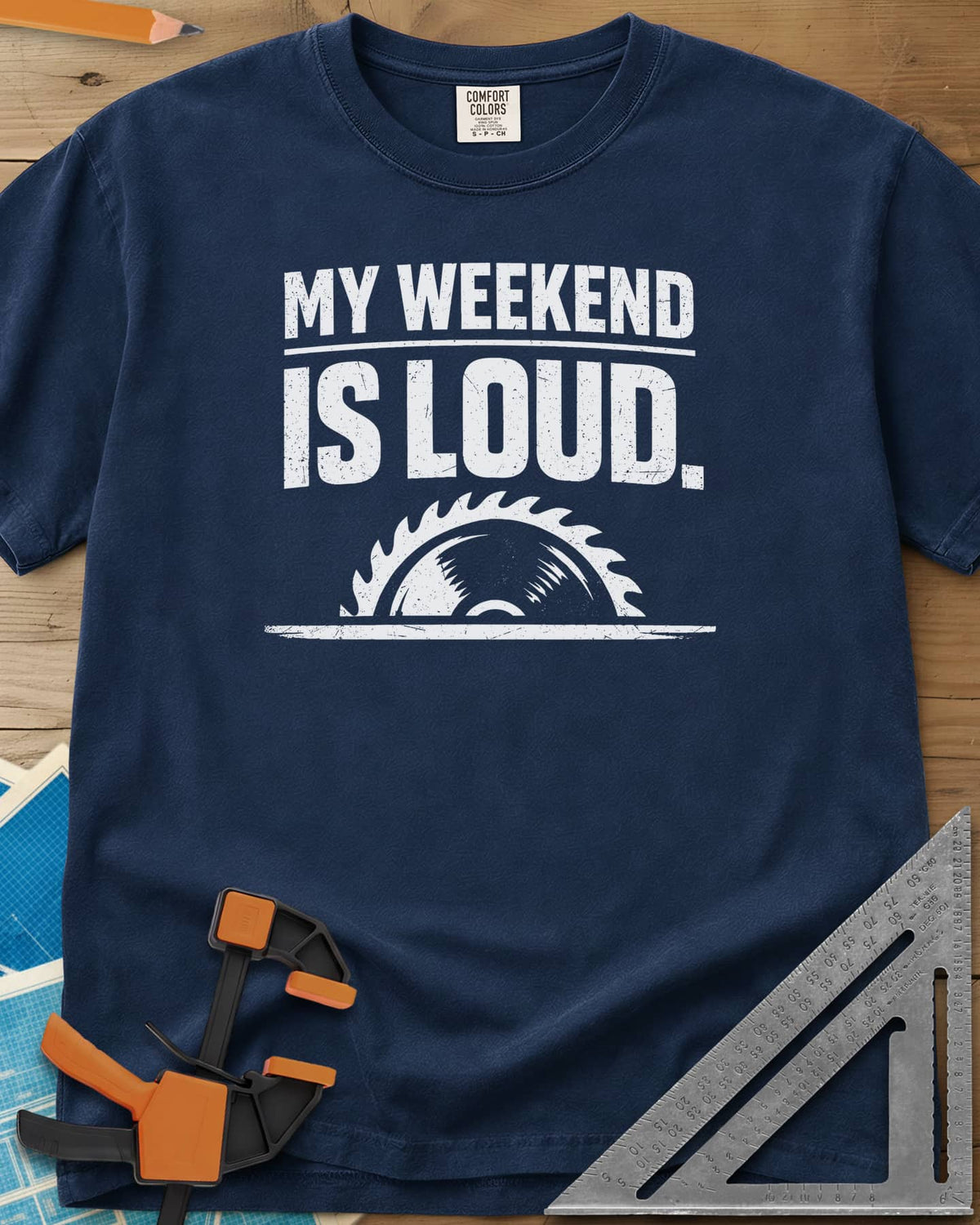 My Weekend Is Loud heavyweight tee in Navy, distressed block lettering over half a saw blade rising from a line