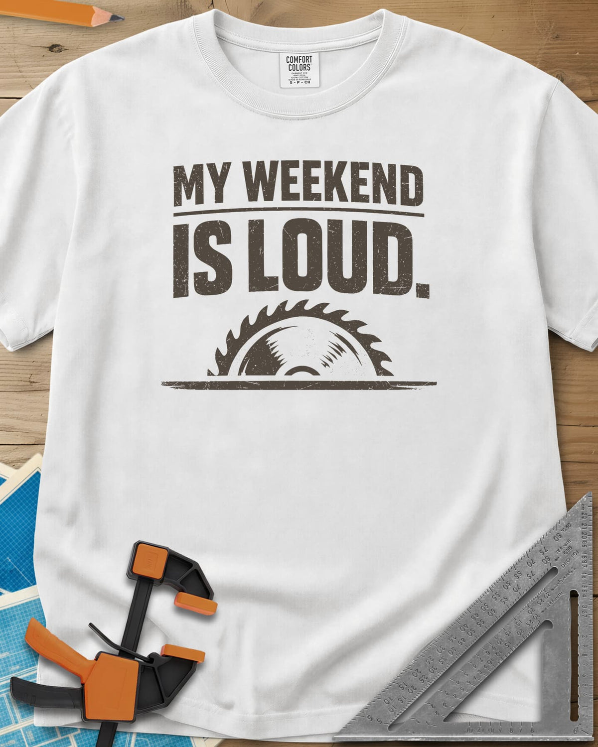 My Weekend Is Loud heavyweight tee in White, distressed block lettering over half a saw blade rising from a line