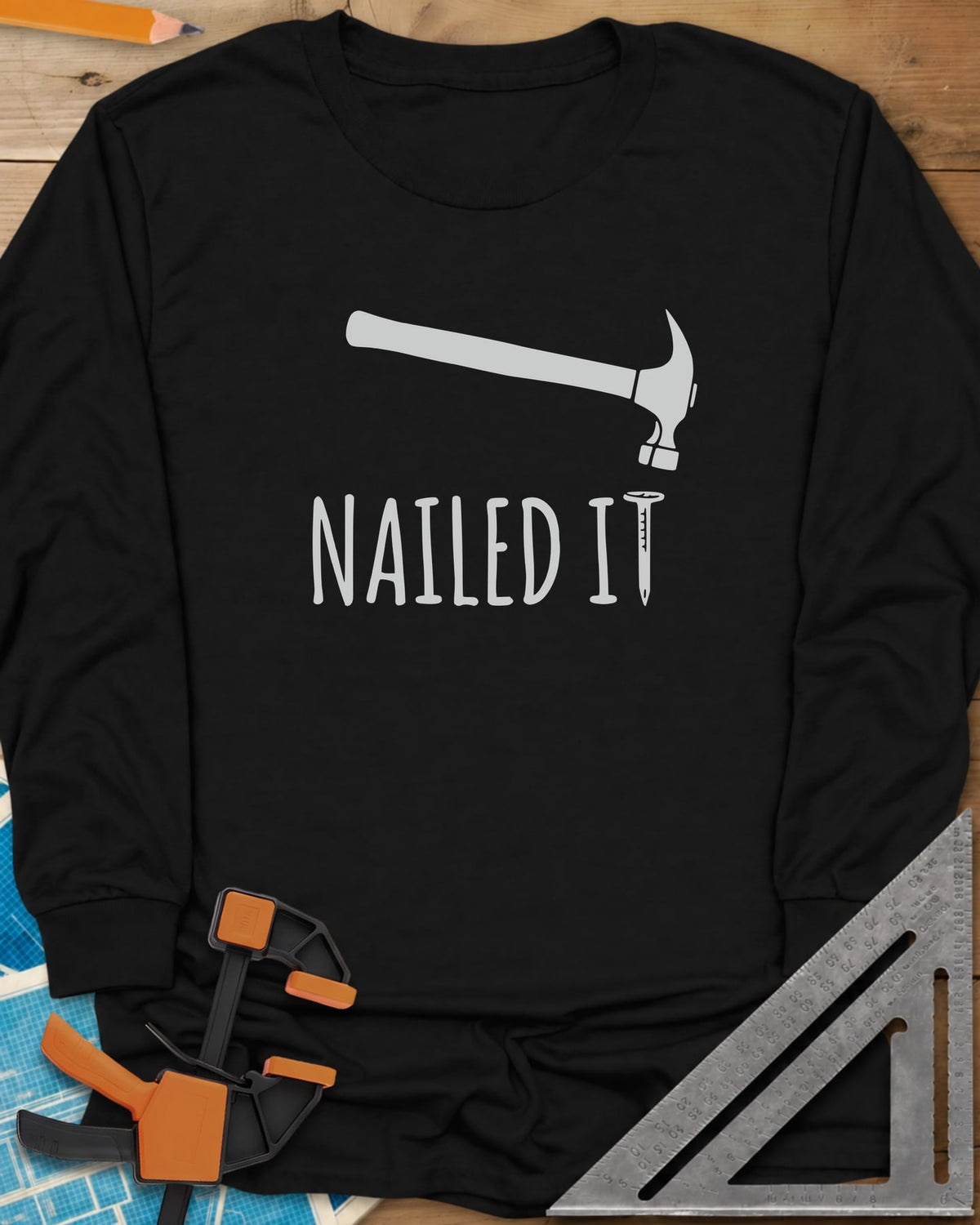 Nailed It long sleeve shirt in Black, a hammer over a nail that forms the T in IT