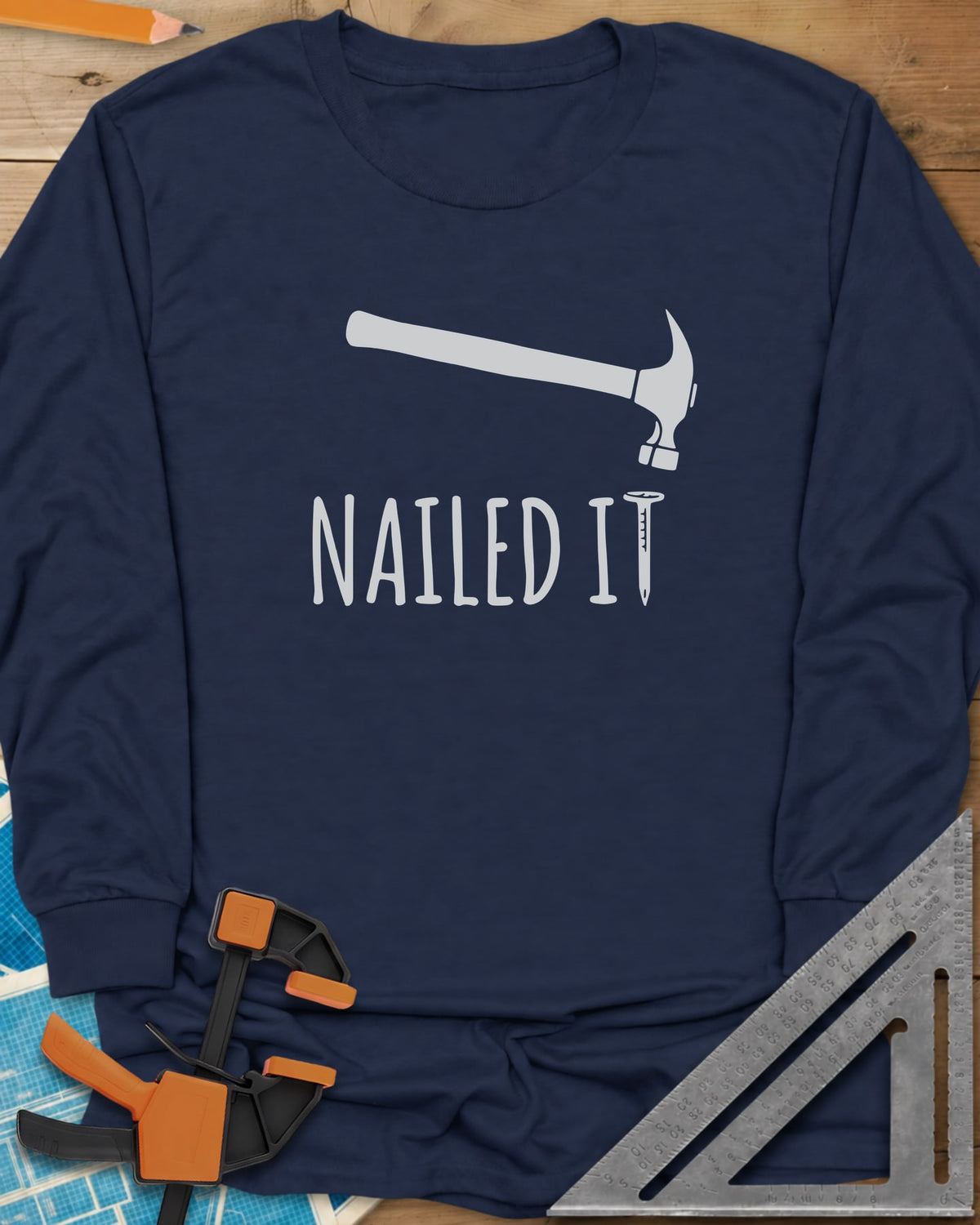 Nailed It long sleeve shirt in Navy, a hammer over a nail that forms the T in IT