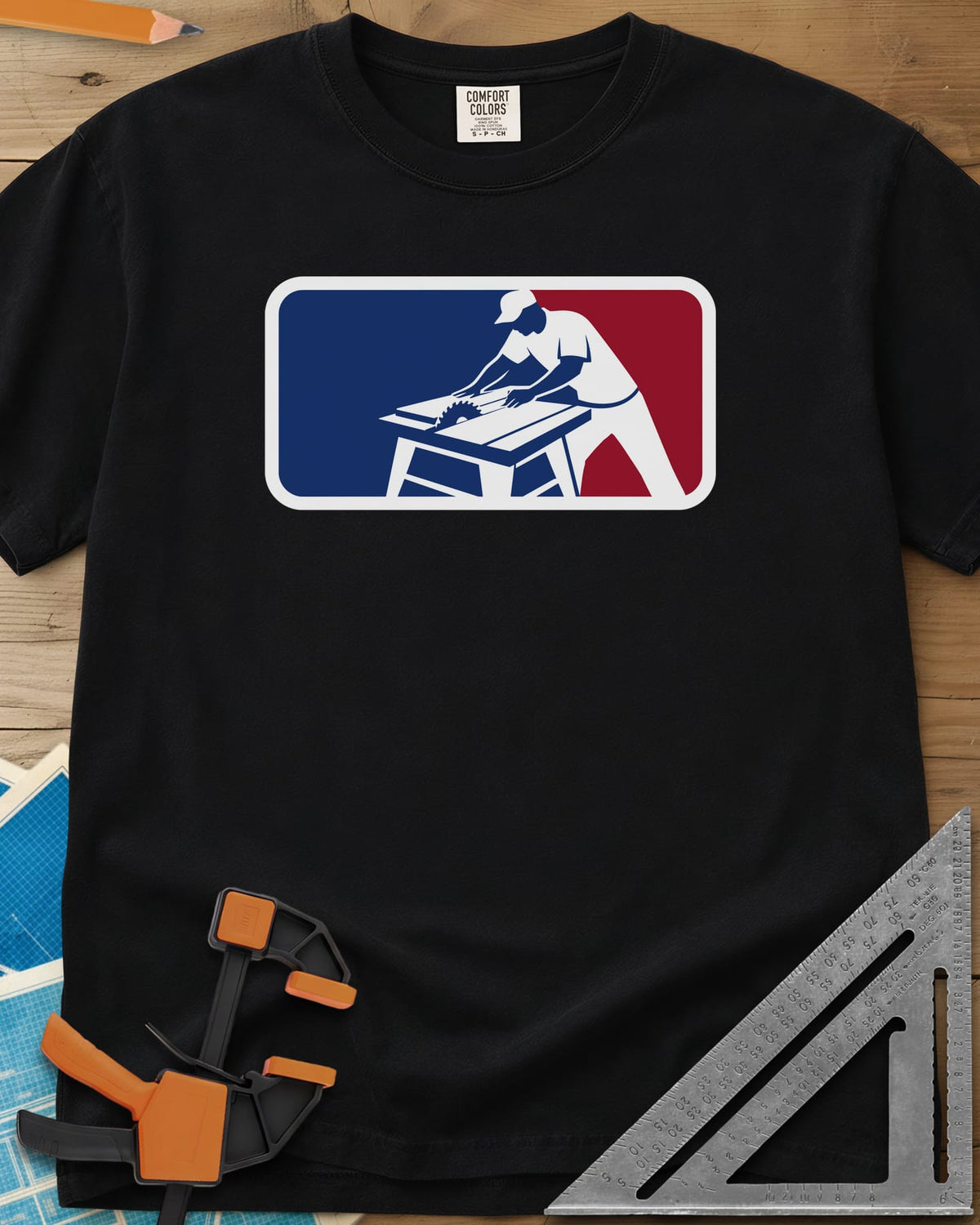 National Woodworking Association heavyweight tee in Black, a worker in a cap leaning over a table saw in a red and blue badge