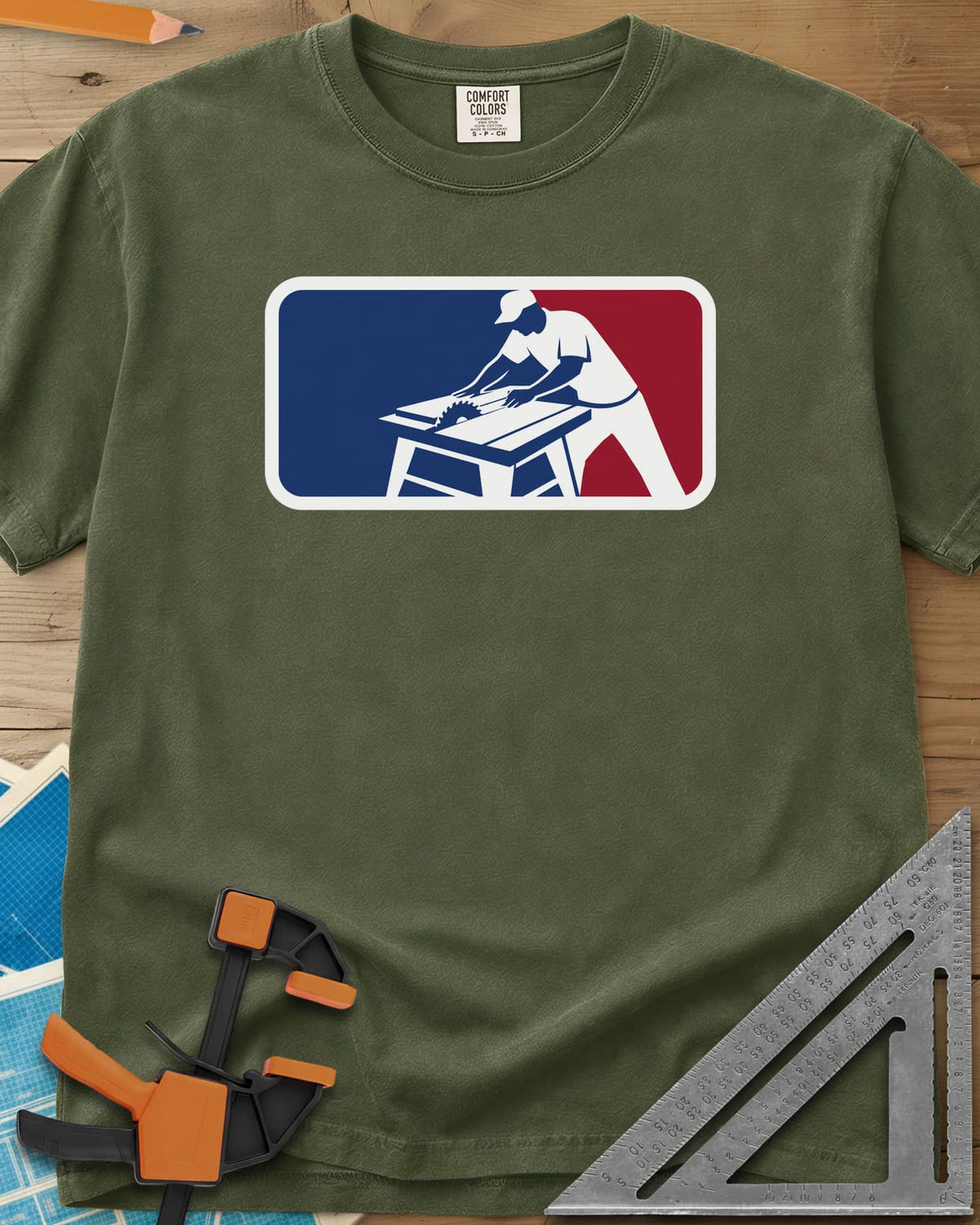 National Woodworking Association heavyweight tee in Hemp, a worker in a cap leaning over a table saw in a red and blue badge