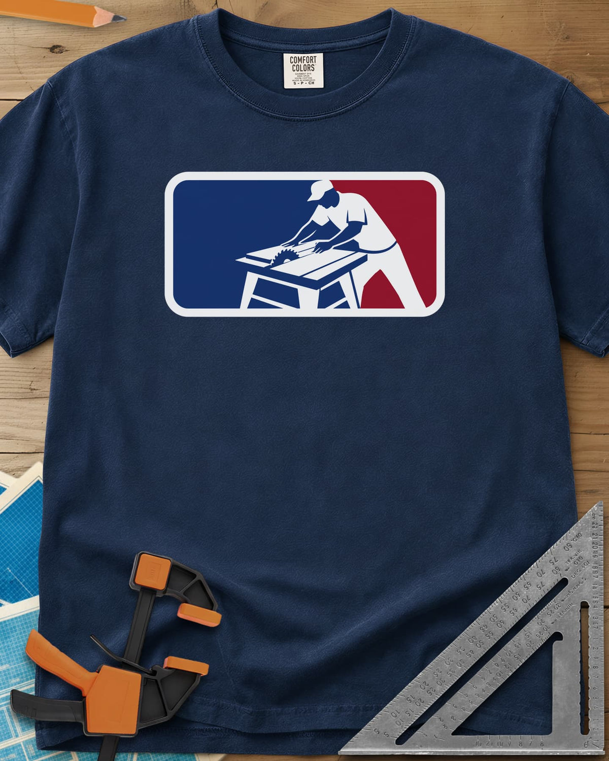 National Woodworking Association heavyweight tee in Navy, a worker in a cap leaning over a table saw in a red and blue badge