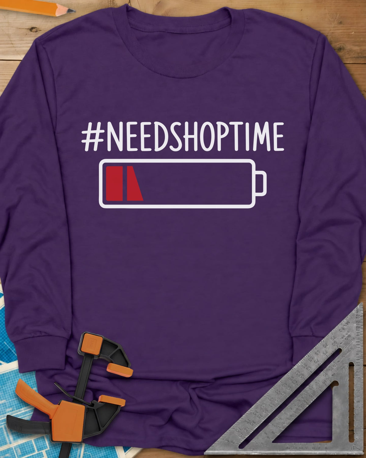 Need Shop Time long sleeve shirt in Purple, hashtag text above a nearly empty red battery icon