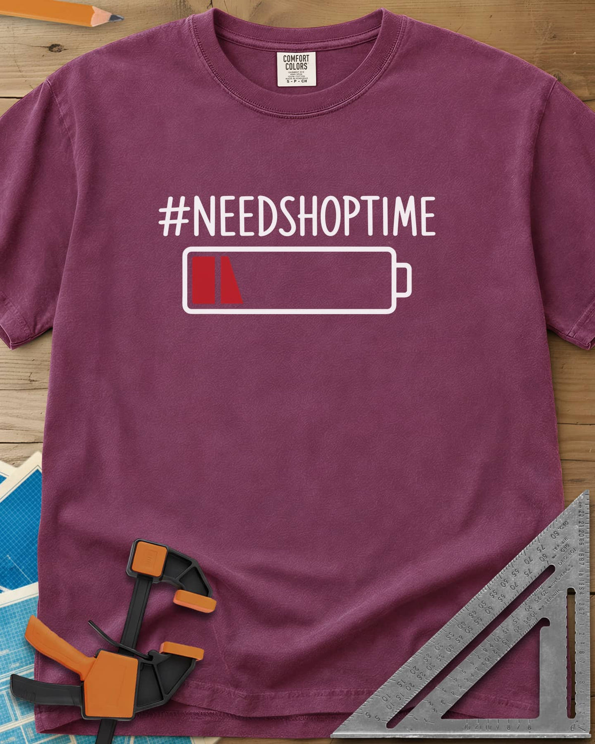 Need Shop Time heavyweight tee in Berry, hashtag text above a nearly empty red battery icon