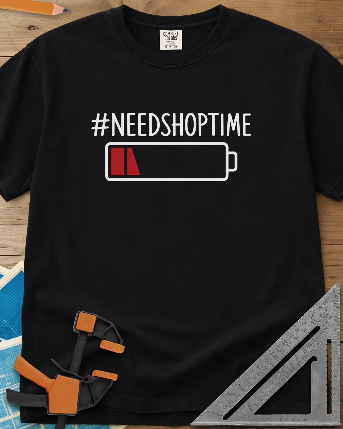 Need Shop Time heavyweight tee in Black, hashtag text above a nearly empty red battery icon