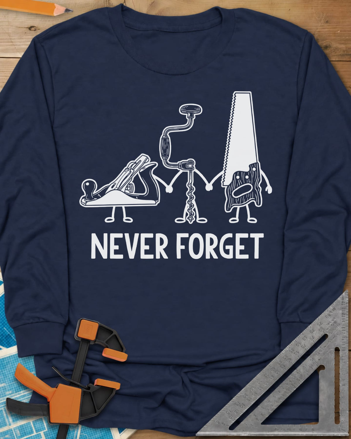 Never Forget long sleeve shirt in Navy, three cartoon hand tools holding hands: a plane, a brace and a saw
