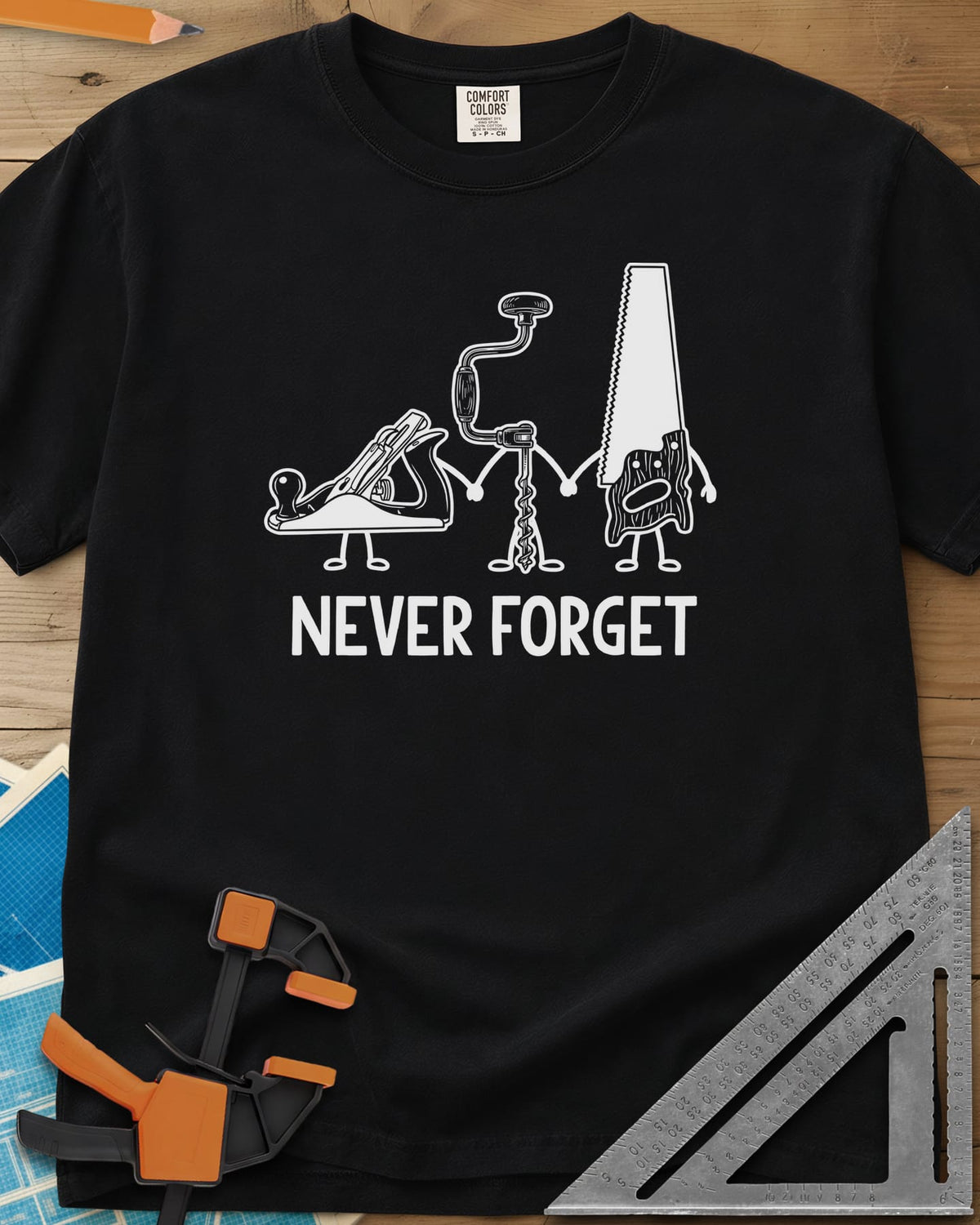 Never Forget heavyweight tee in Black, three cartoon hand tools holding hands: a plane, a brace and a saw
