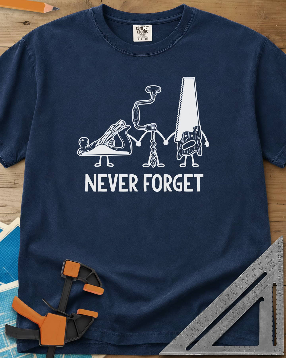Never Forget heavyweight tee in Navy, three cartoon hand tools holding hands: a plane, a brace and a saw